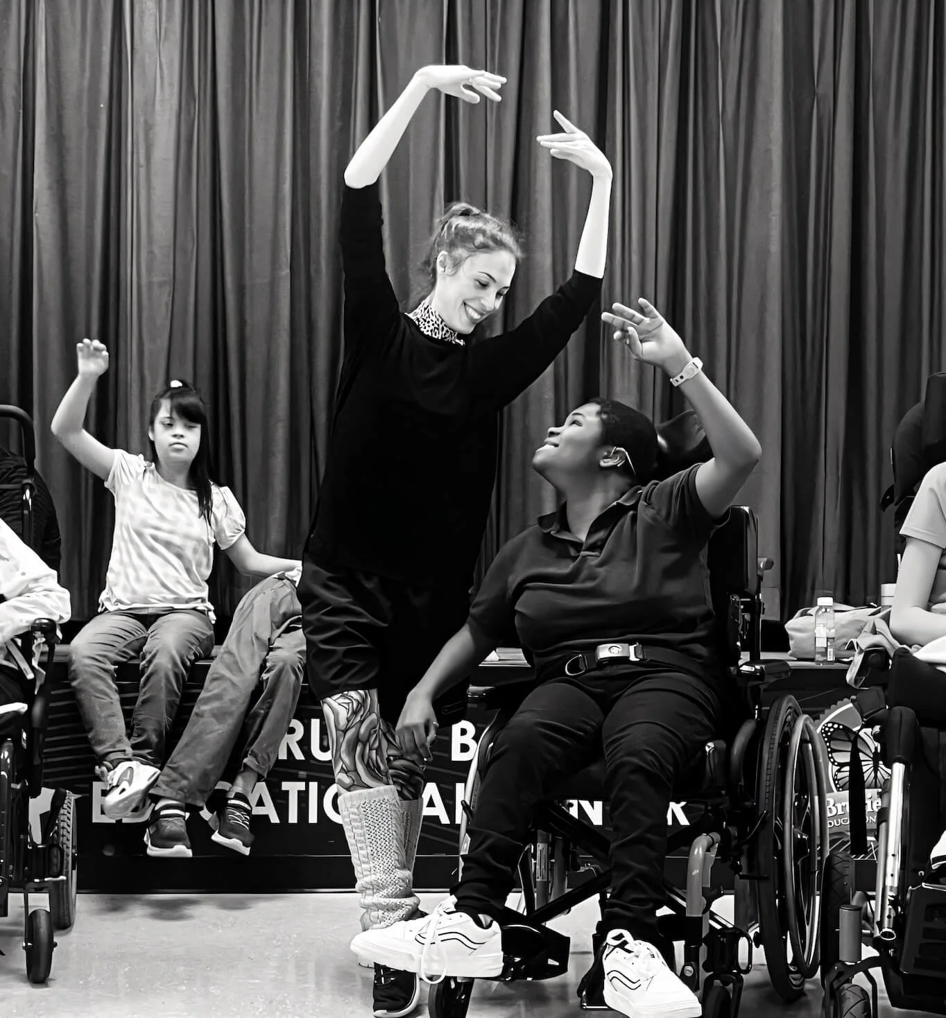 Emily Ricca professional ballet educator leading inclusive community dance workshop with students