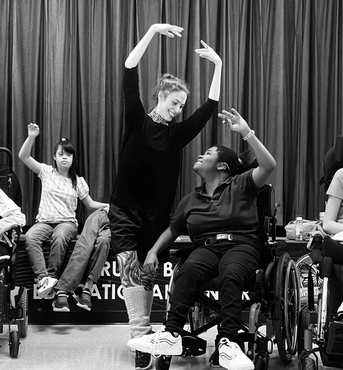 Emily Ricca professional ballet educator leading inclusive community dance workshop with students