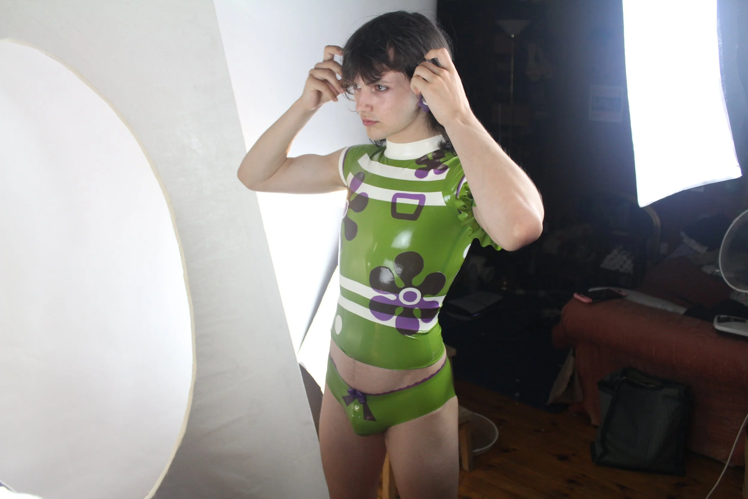 William. F. Henderson wearing the green and purple Scooby Do inspired latex ensemble. Shot by Pip Aldridge. 