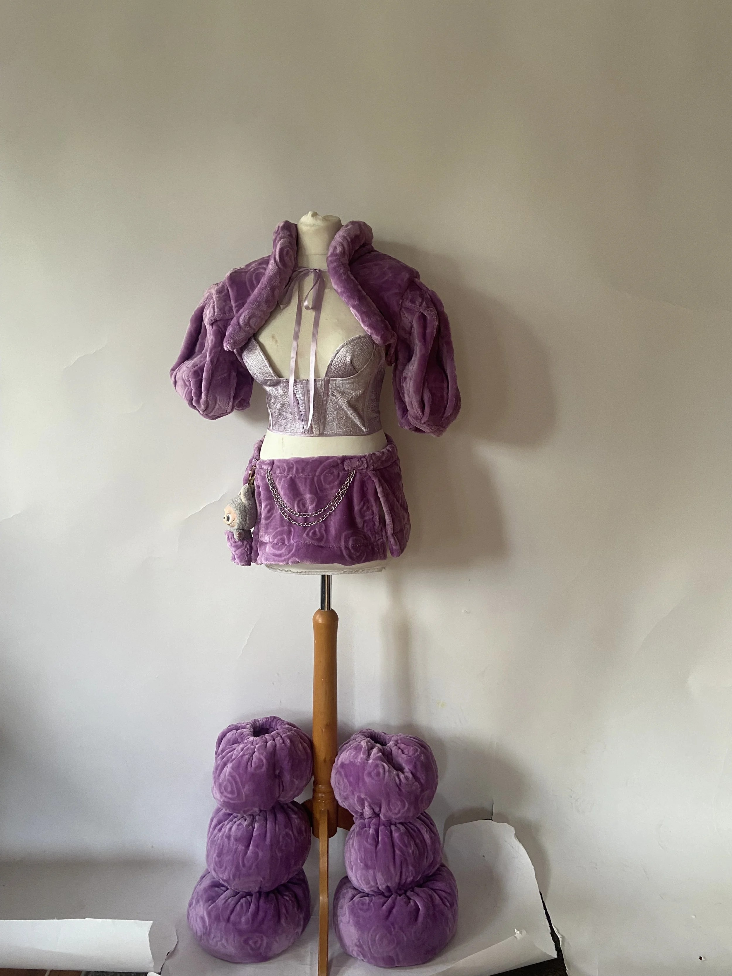 Custom purple Labubu puffer set for Chai T Grande. Shot by William. F. Henderson.