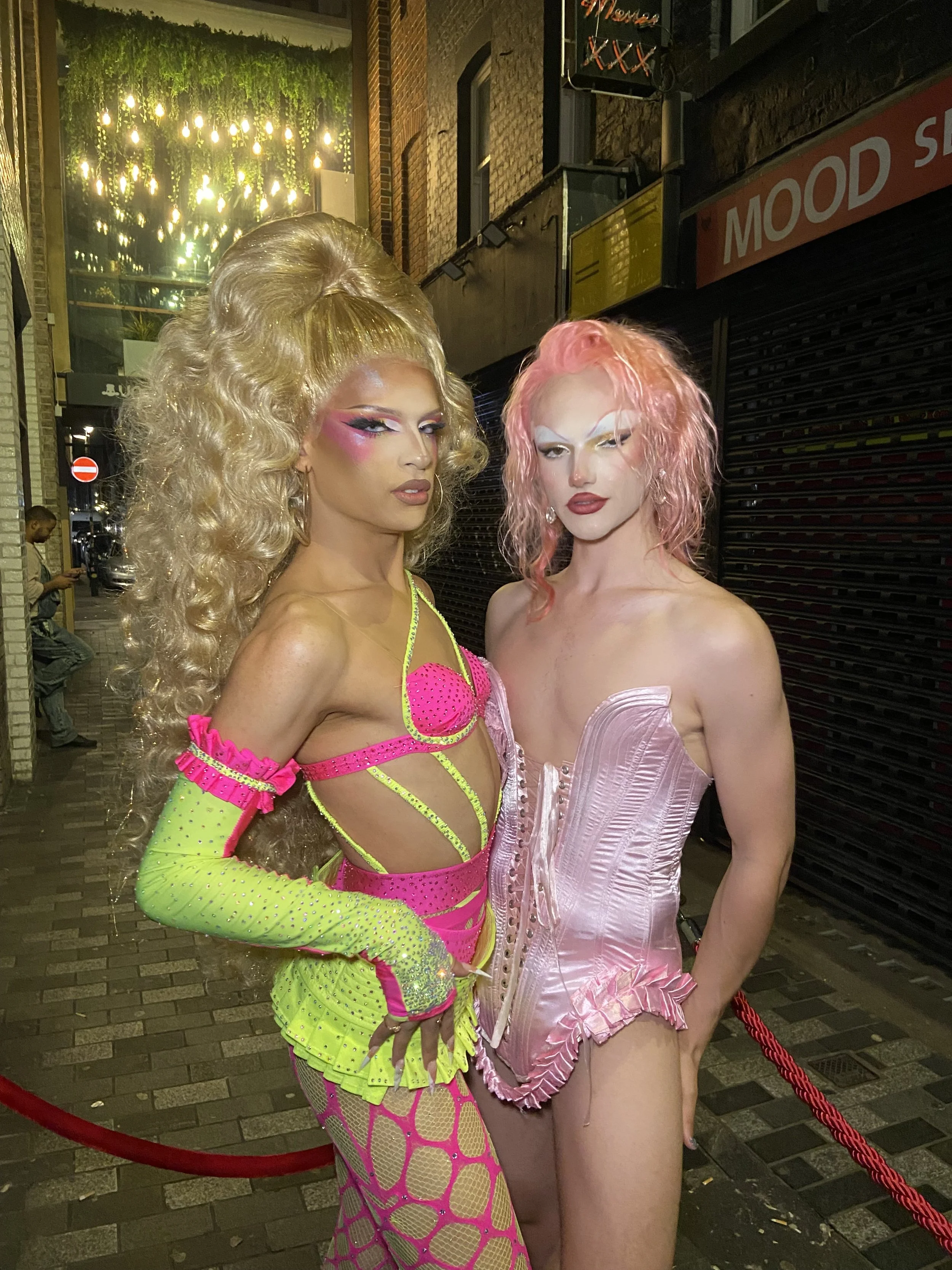 Kikiara in custom yellow and pink missing ensemble. Wilma Hickey Heel in pink pin cushion corset. 