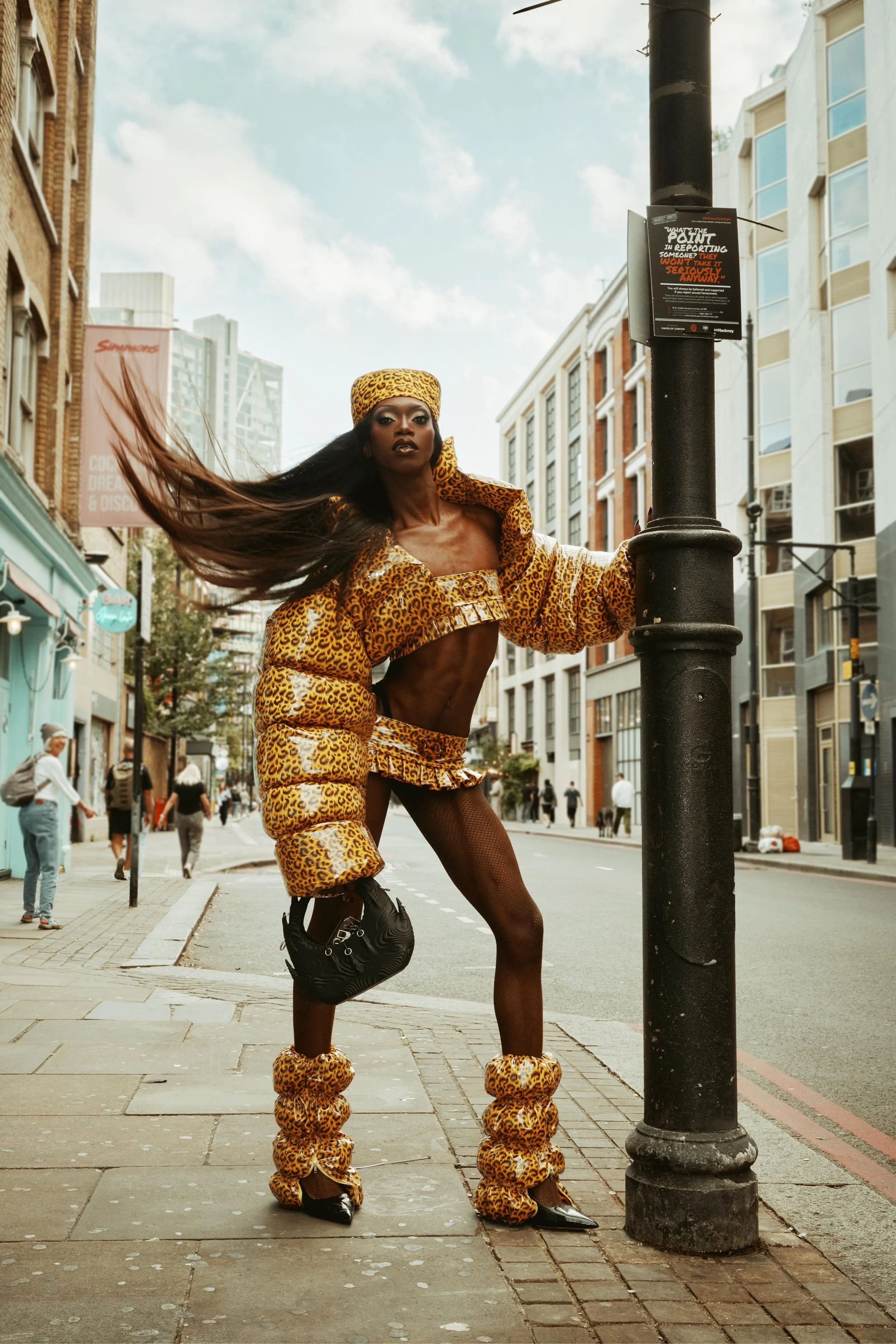 Black Peppa attending London Fashion Week in custom puffer coat and skirt ensemble.
Photos by Kim Lang.