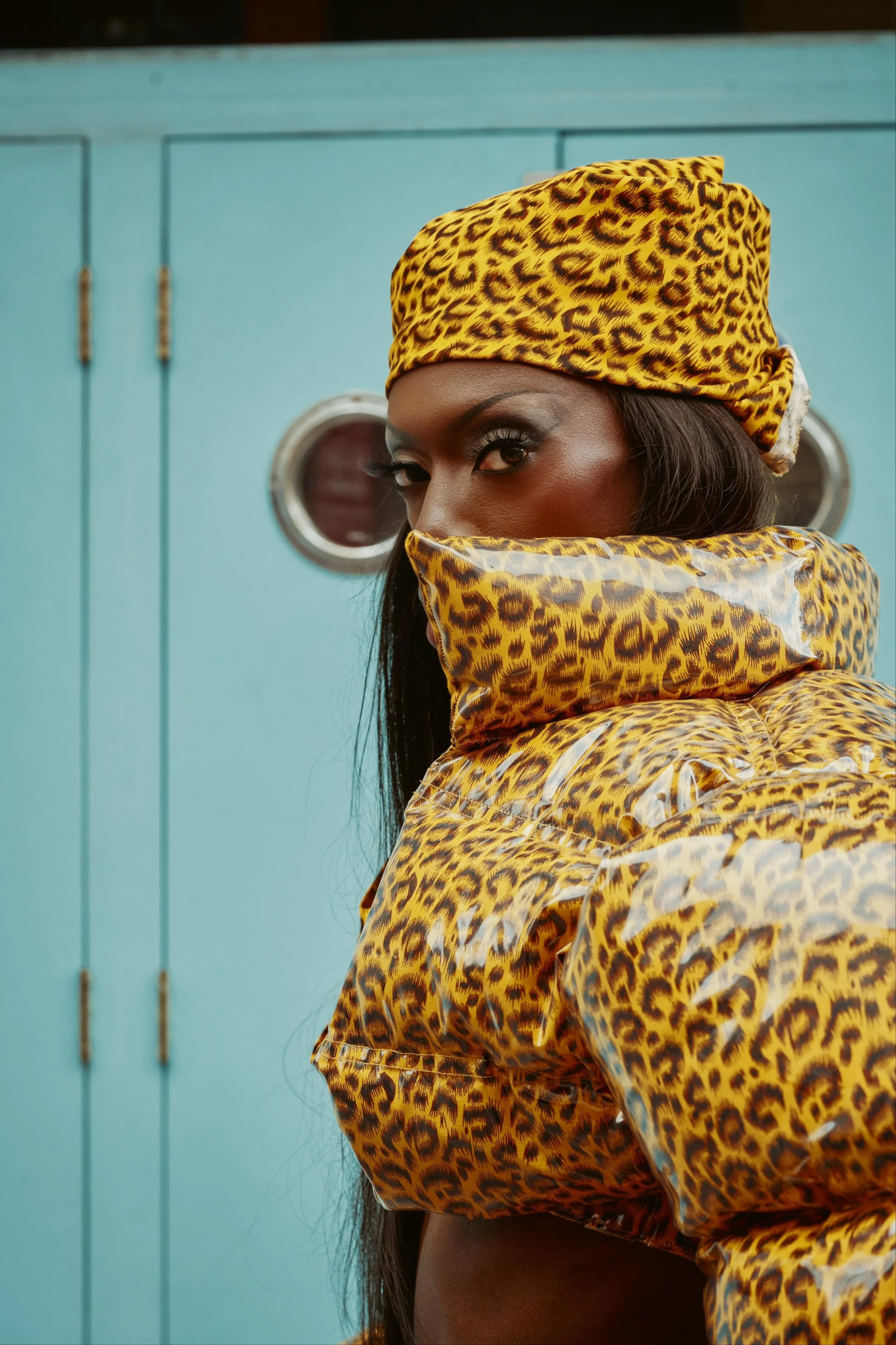 Black Peppa attending London Fashion Week in custom puffer coat and skirt ensemble.
Photos by Kim Lang.