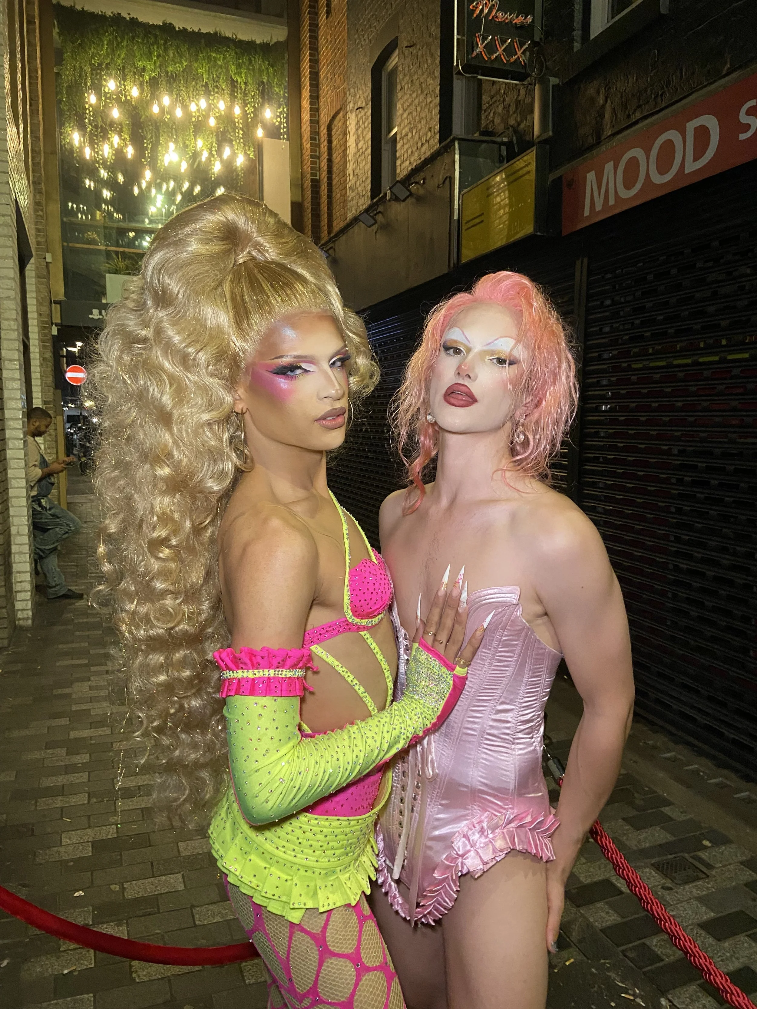 Kikiara in custom yellow and pink missing ensemble. Wilma Hickey Heel in pink pin cushion corset. 