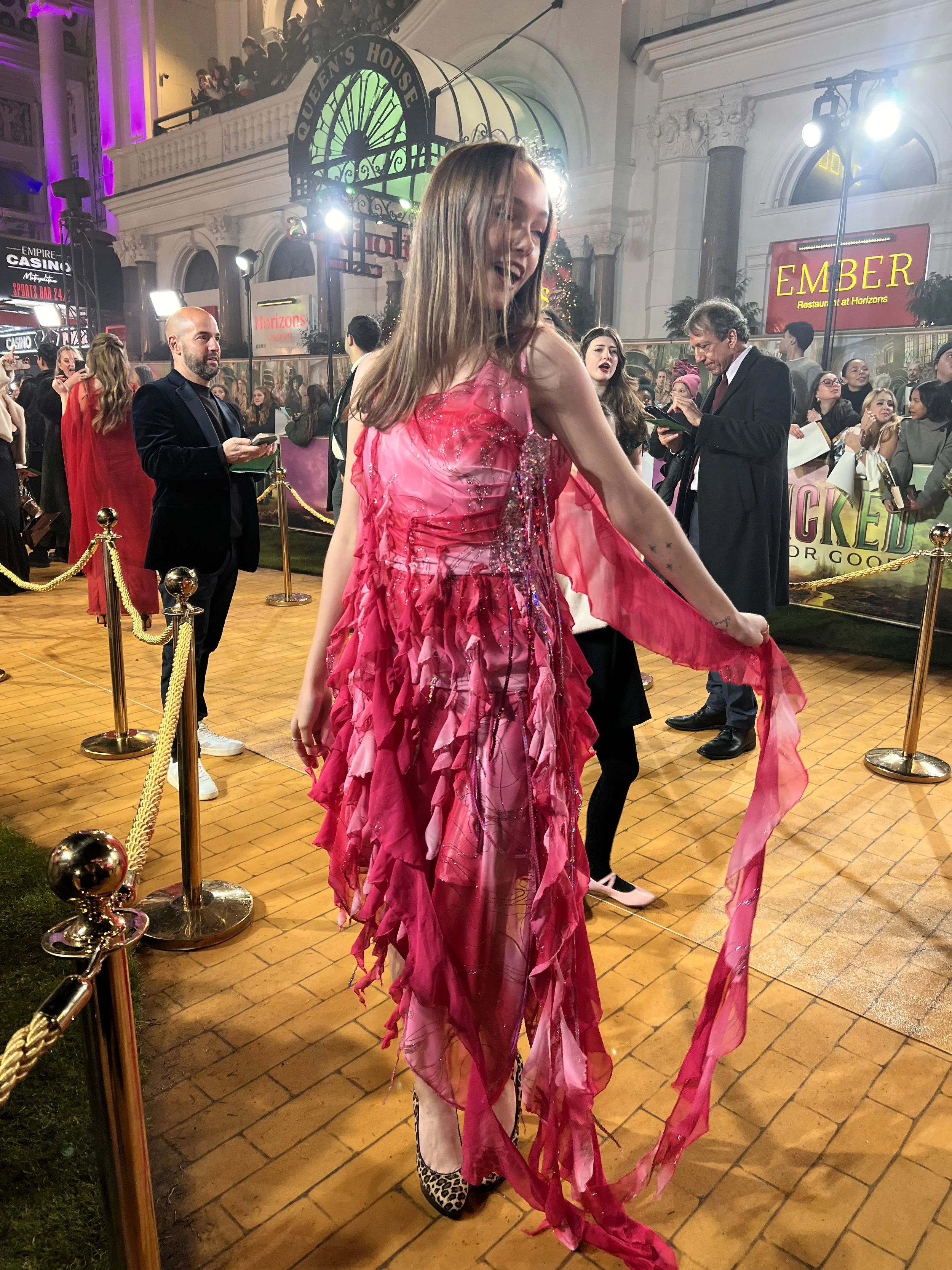 Scarlet Valentine wearing the unreleased pink flower fairy dress at the Wicked For Good 2025 premiere. 