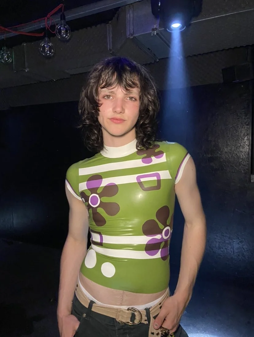 William. F. Henderson wearing the Scooby Do latex baby- tee. 