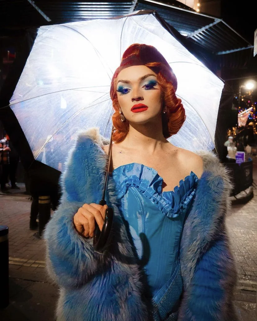 Angel Pinks in custom blue corset
