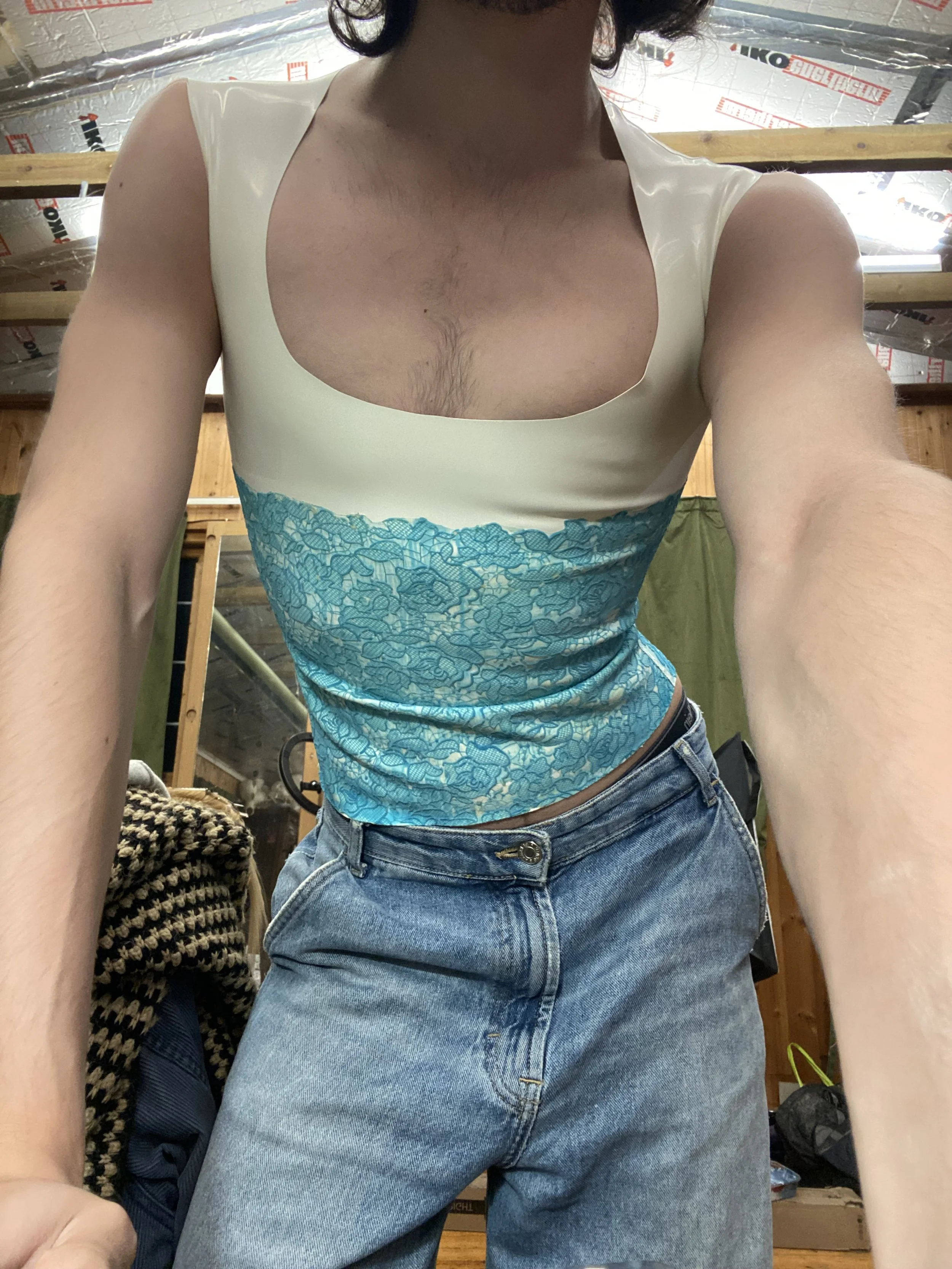 William. F. Henderson wearing the latex lace low cut vest.