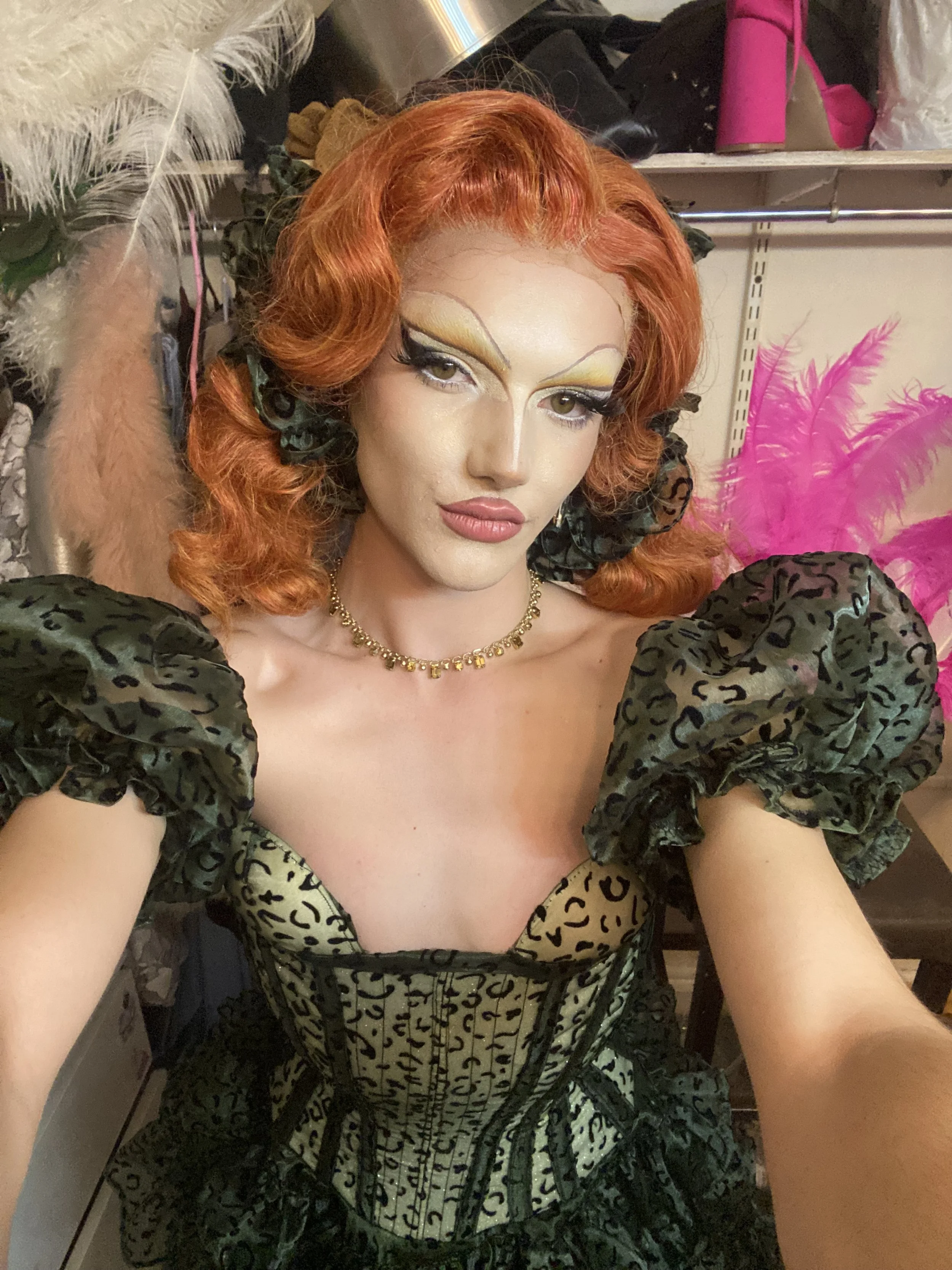 Wilma Hickey Heel in green leopard hourglass corset and skirt.