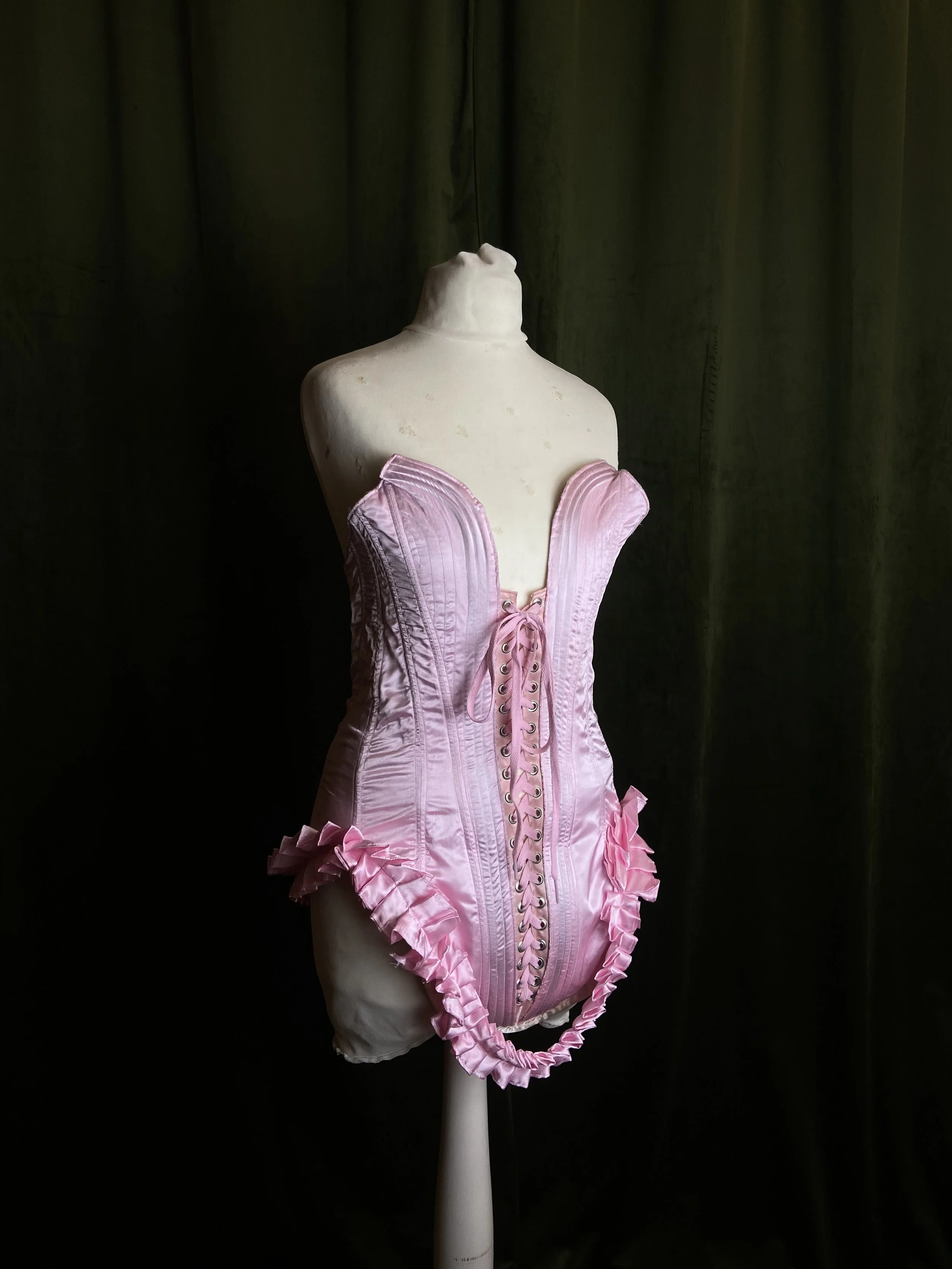Pink corset from Pin Cushion Piece set for Wilma Hickey Heel shot by Williamfhenderson