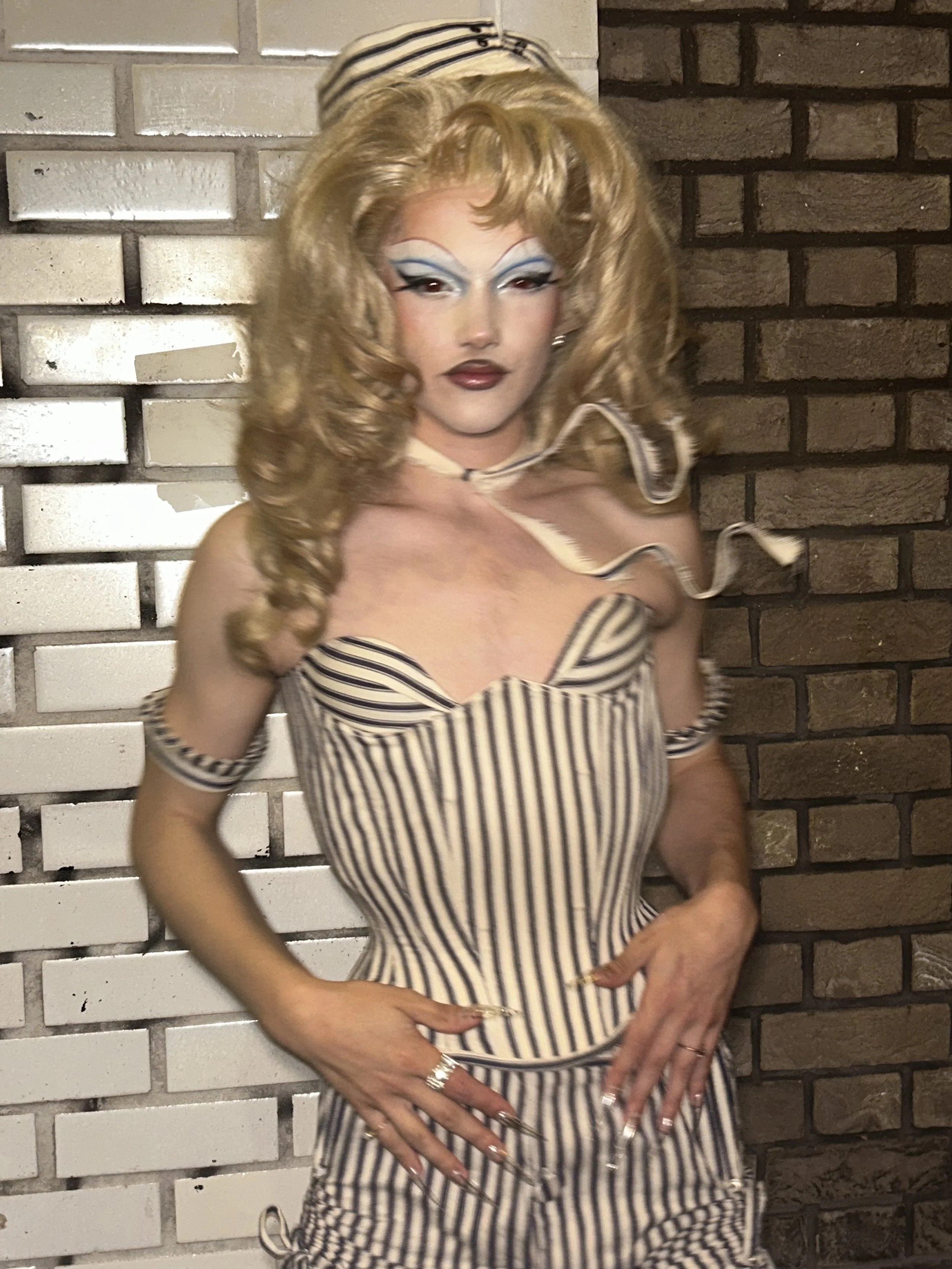 Wilma Hickey Heel in sailor hourglass corset and shorts. 