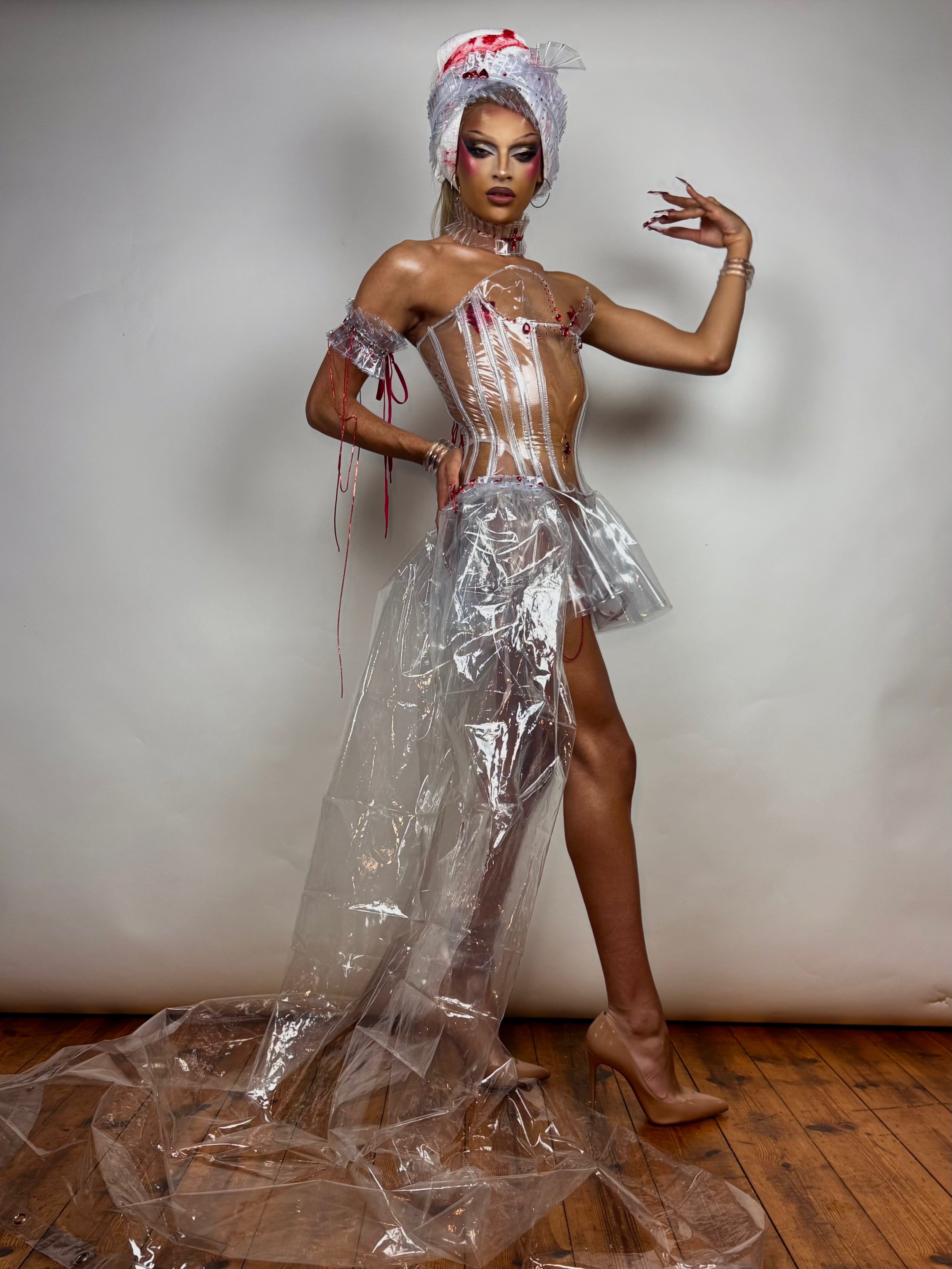 Kikiara wearing custom plastic hourglass corset for Halloween 2025. Shot by William. F. Henderson. Retouched by Kikiara.