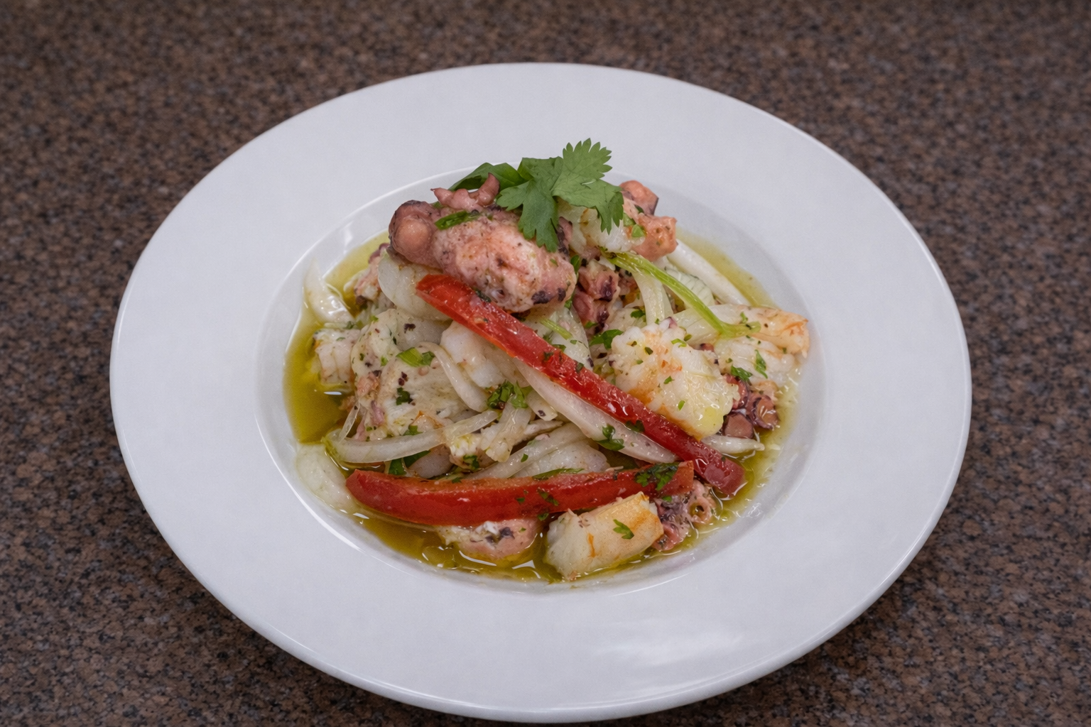 Octopus ceviche with cilantro garnish.png