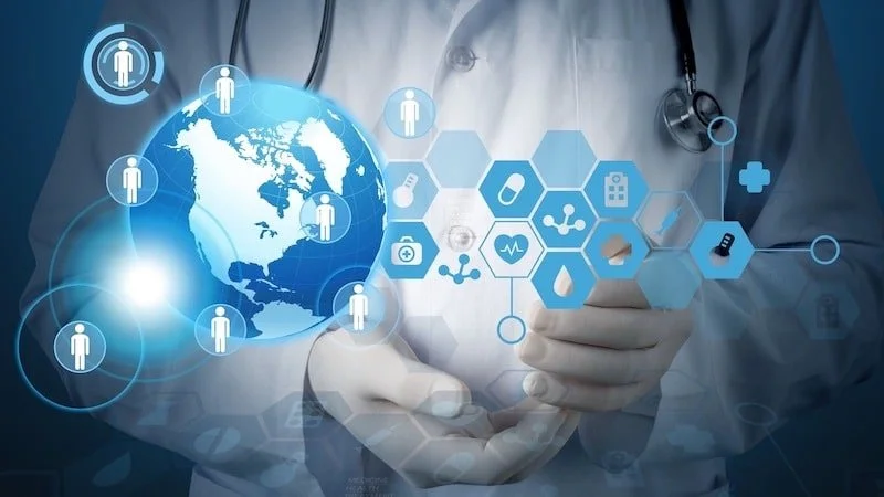 A healthcare professional holding a digital globe with connected healthcare icons and medical symbols, symbolizing global healthcare and telemedicine.