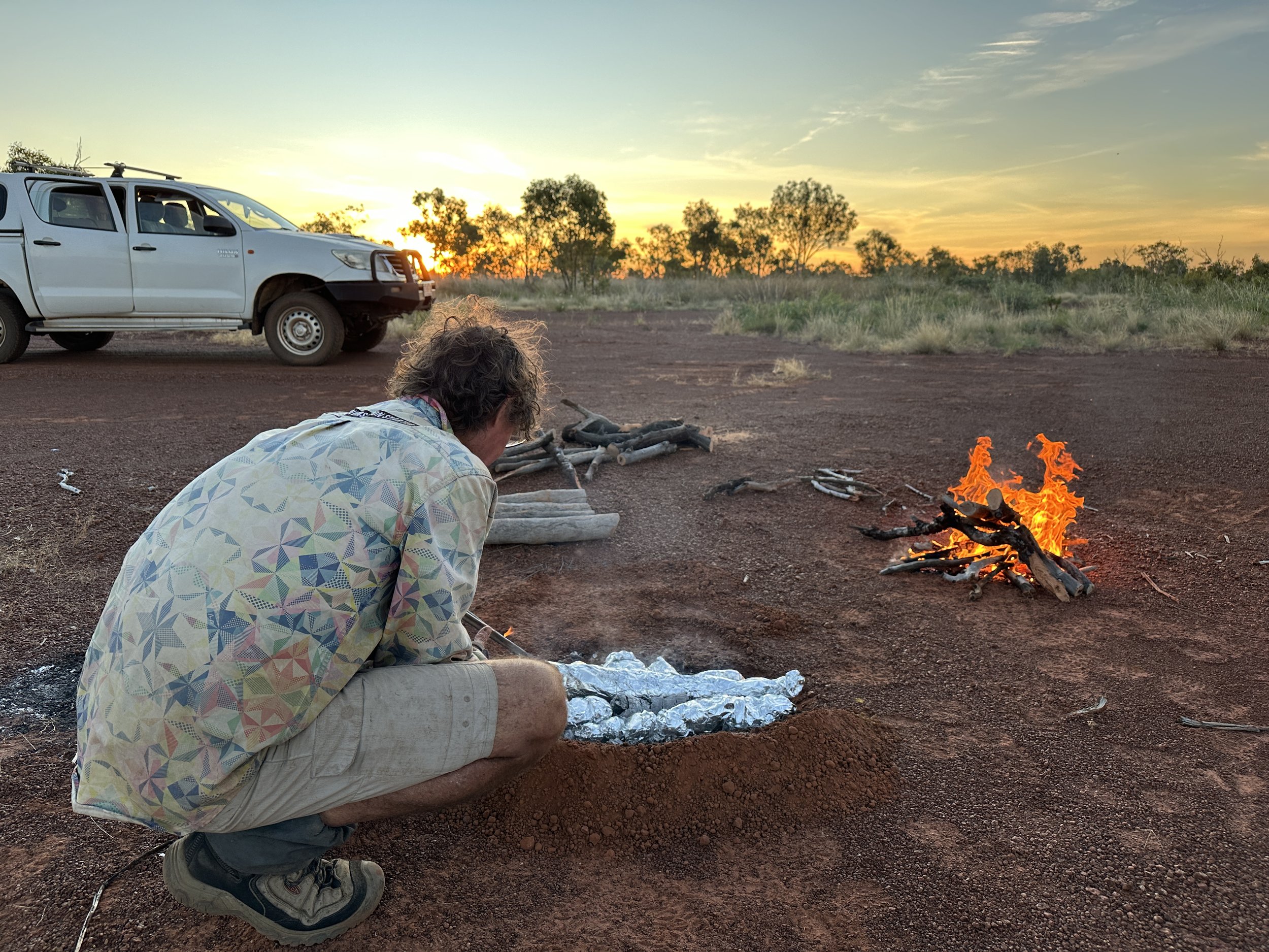 Kym Brennan cooking kangaroo tail and potatoes.