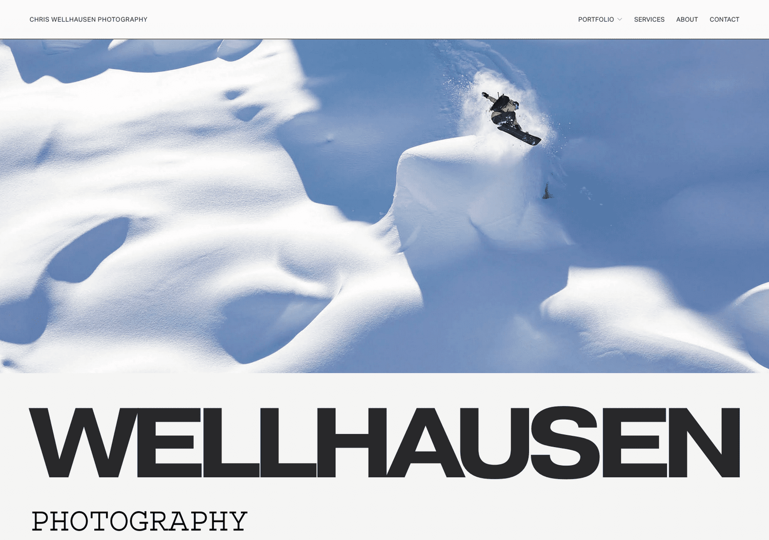 Chris Wellhausen photography website with a snowboarder on a snow feature and the Wellhausen wordmark