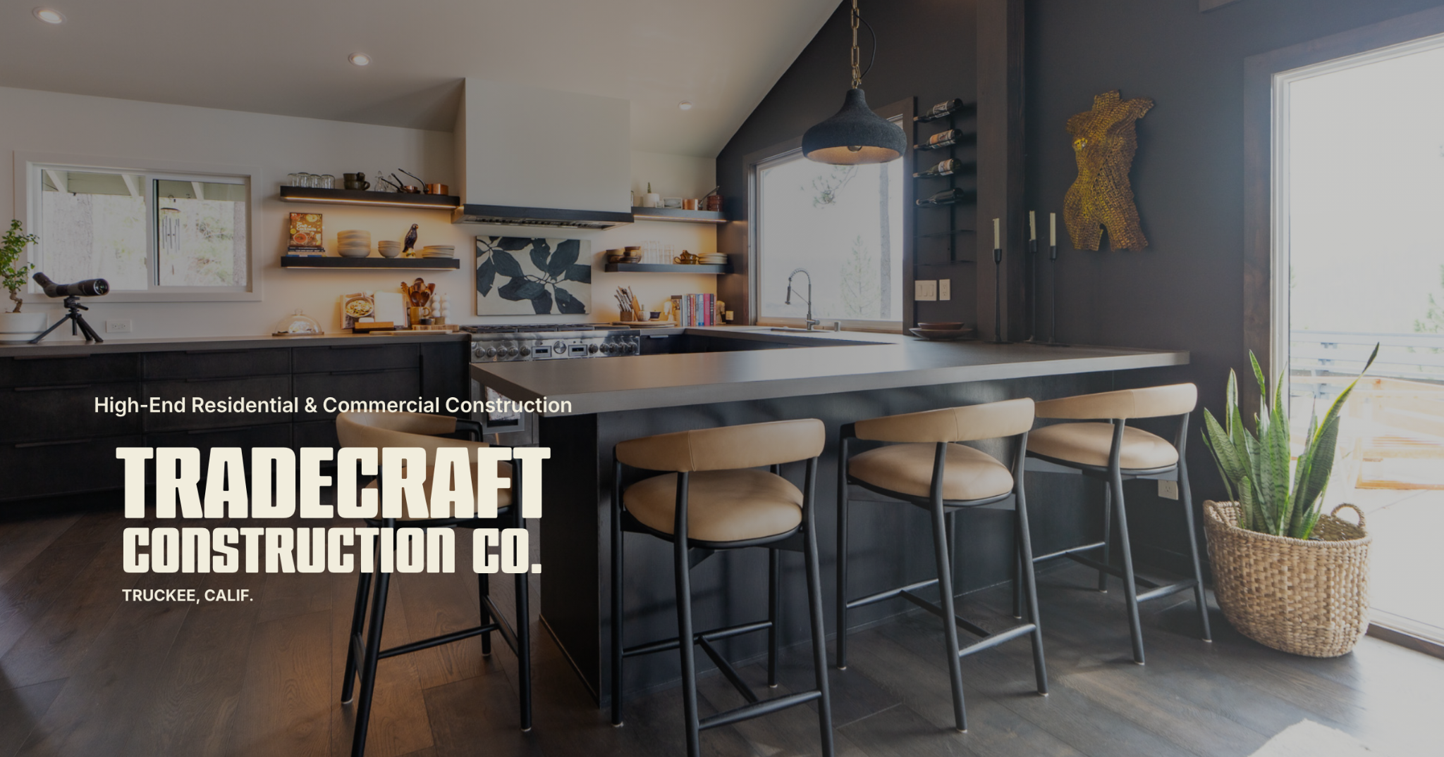 Tradecraft Construction brand identity presented over a residential kitchen project