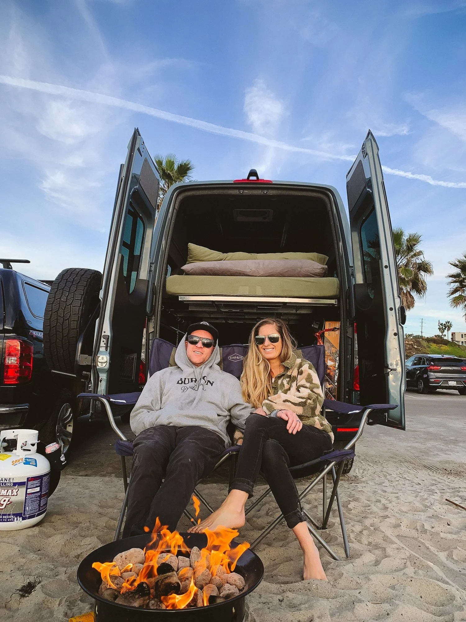 Two people beside a camper van, from Seeker Creative Studio photography