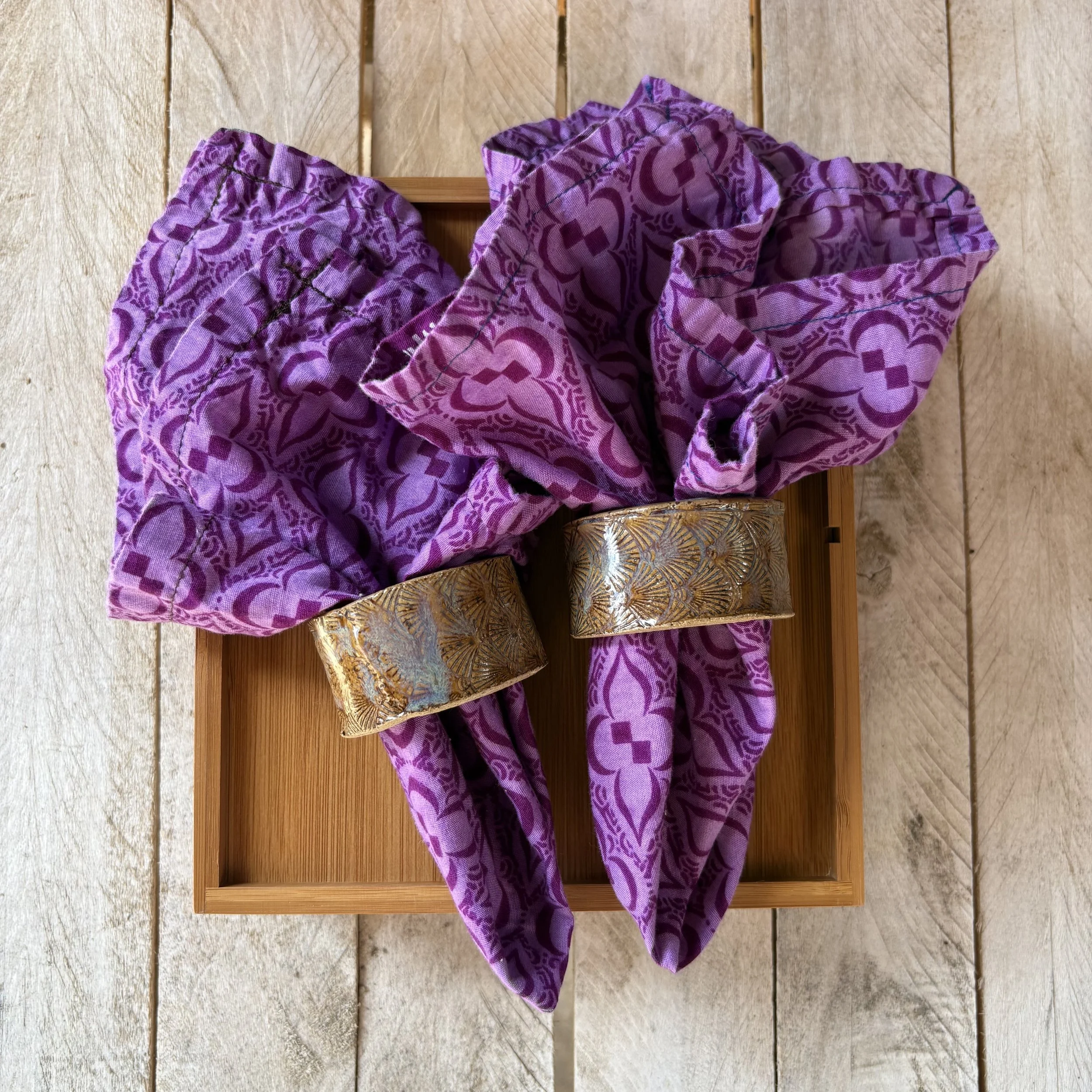 purple napkins and napkin holders