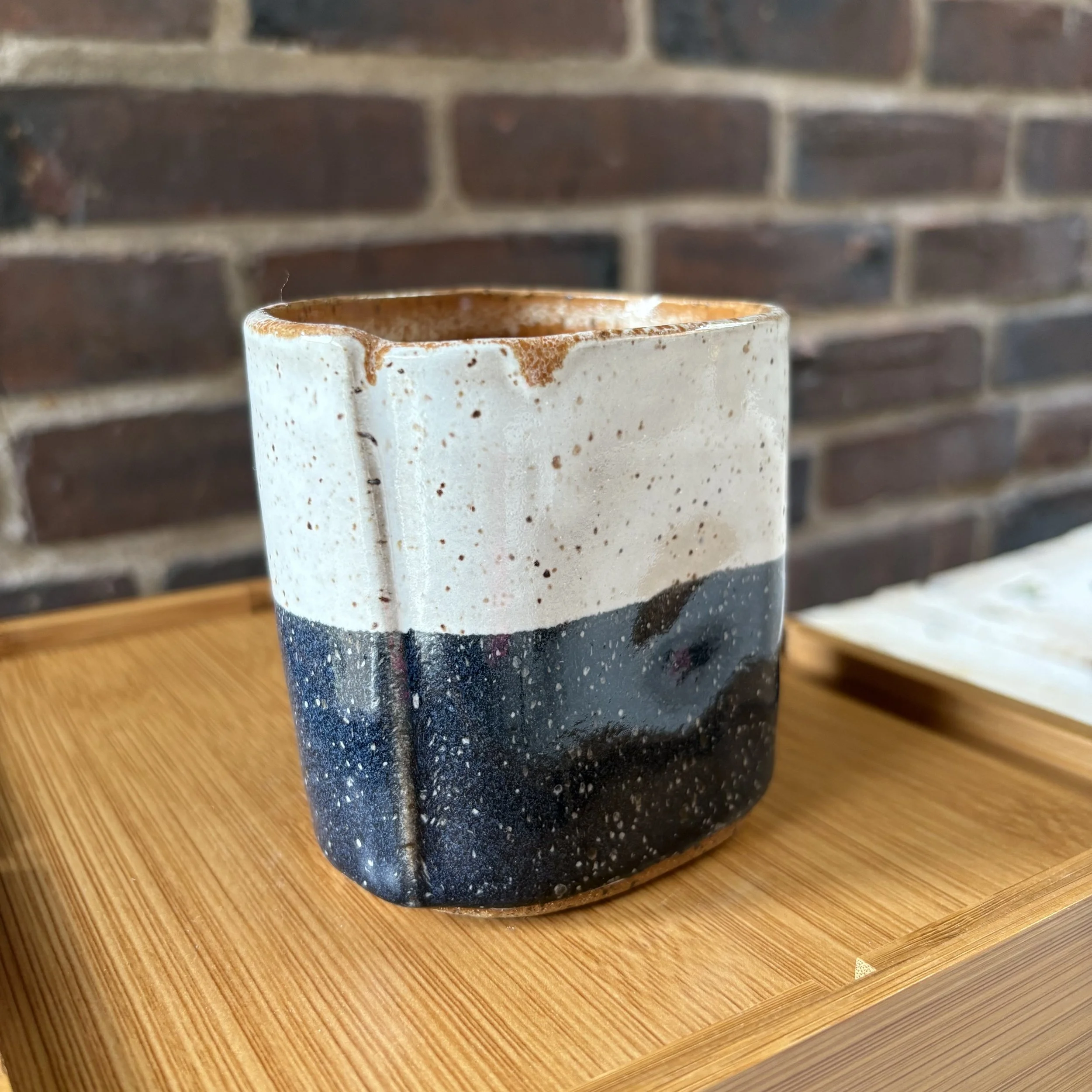 Black and white tumbler with indent