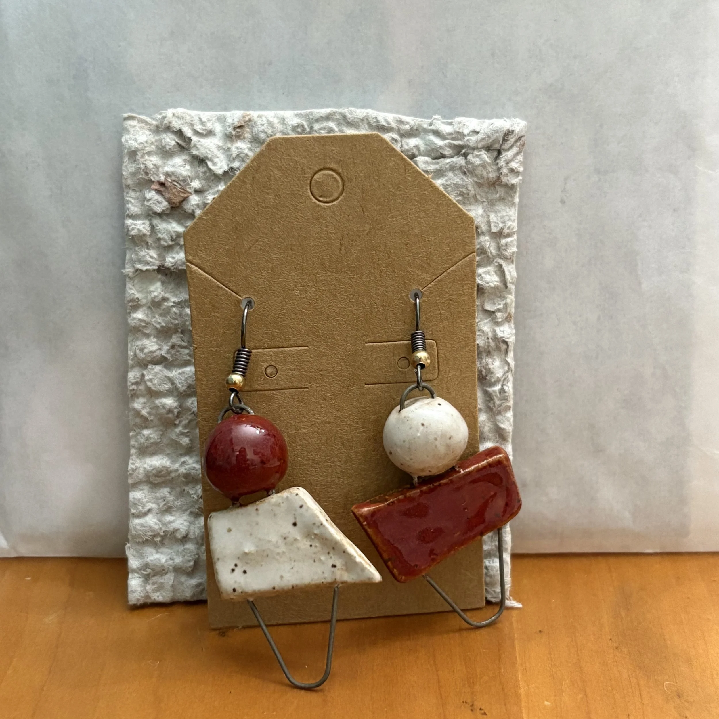 Cinnabar and white geometric earrings
