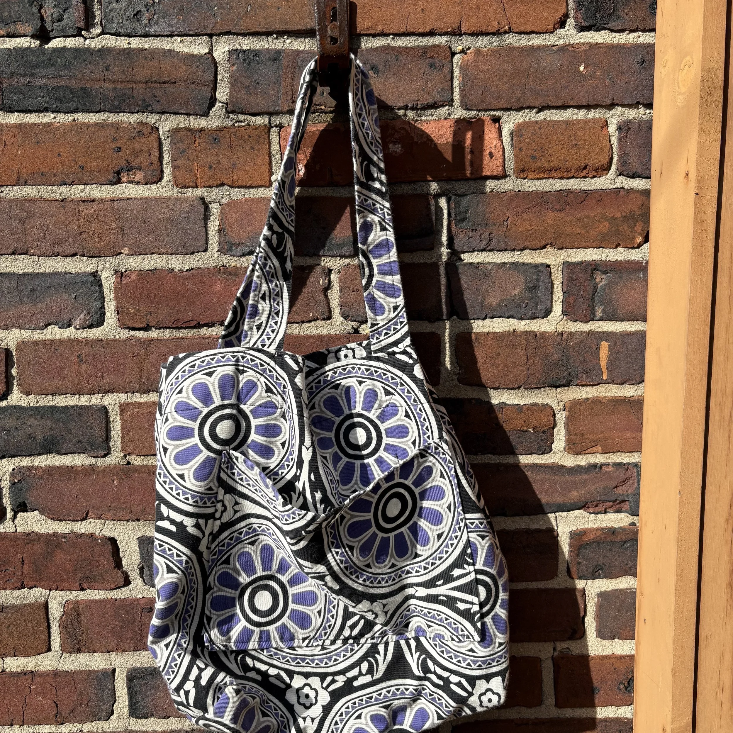 purple and black design bag