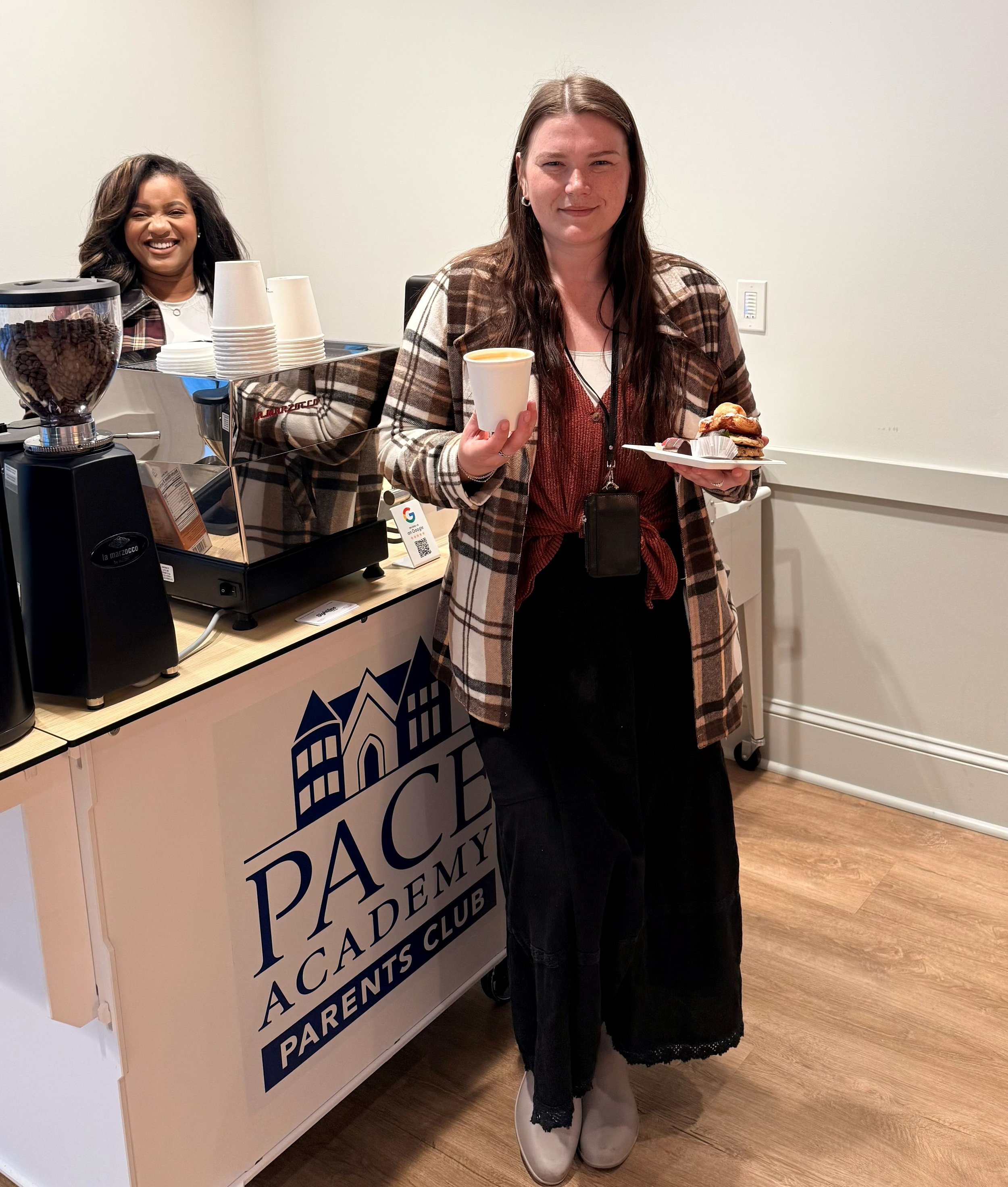 Teacher holding iced latte from Atlanta coffee catering company