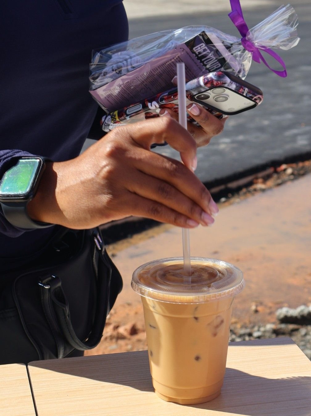 Guest holding iced matcha at coffee cart Atlanta grand opening event