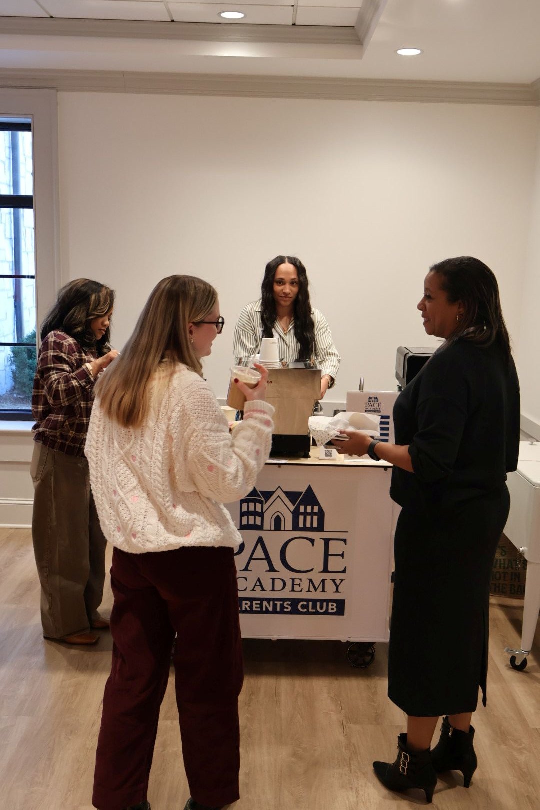 Teachers lined up at Atlanta coffee catering cart during appreciation week