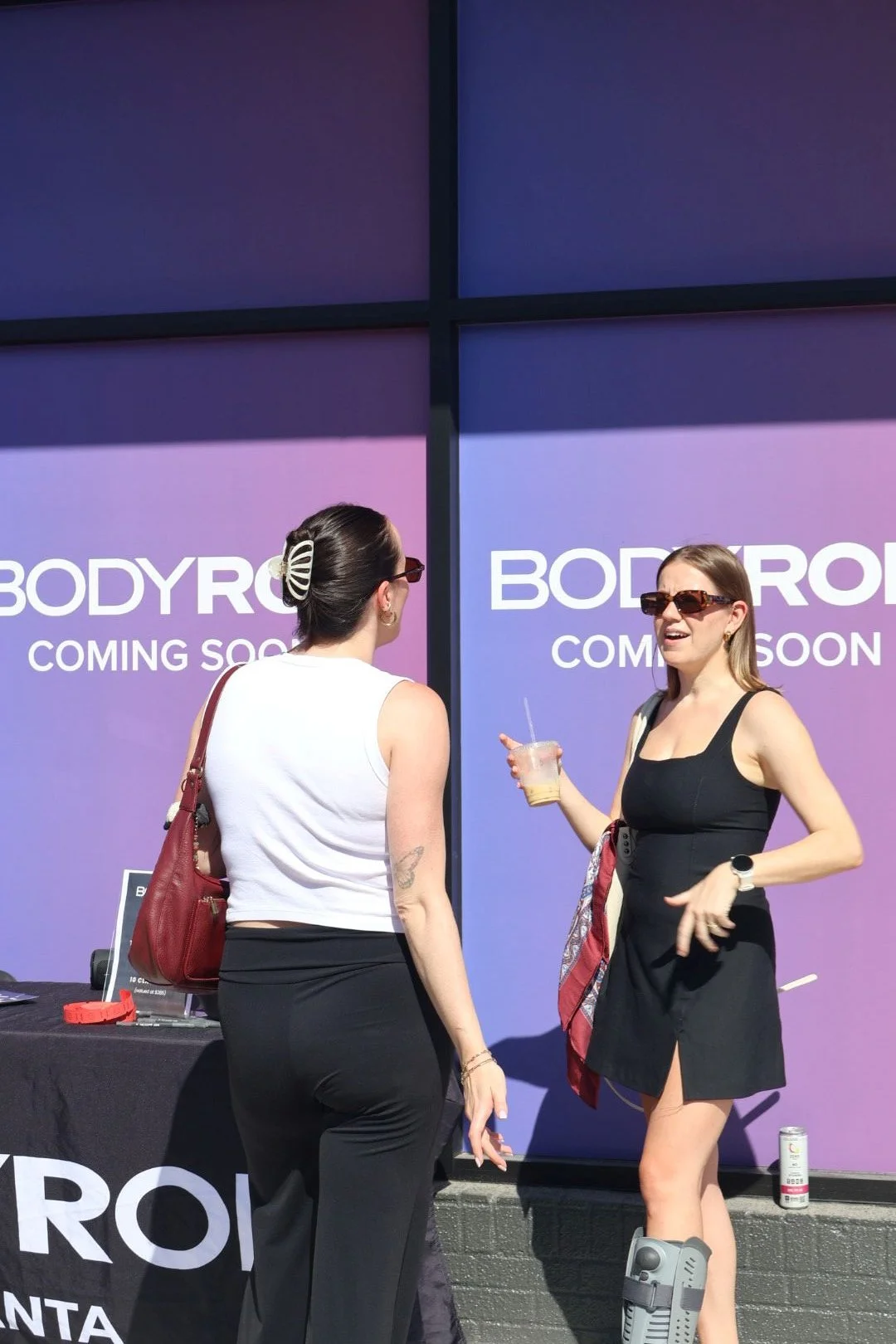 BODYROK Brookhaven guest holding drink from Atlanta coffee cart service
