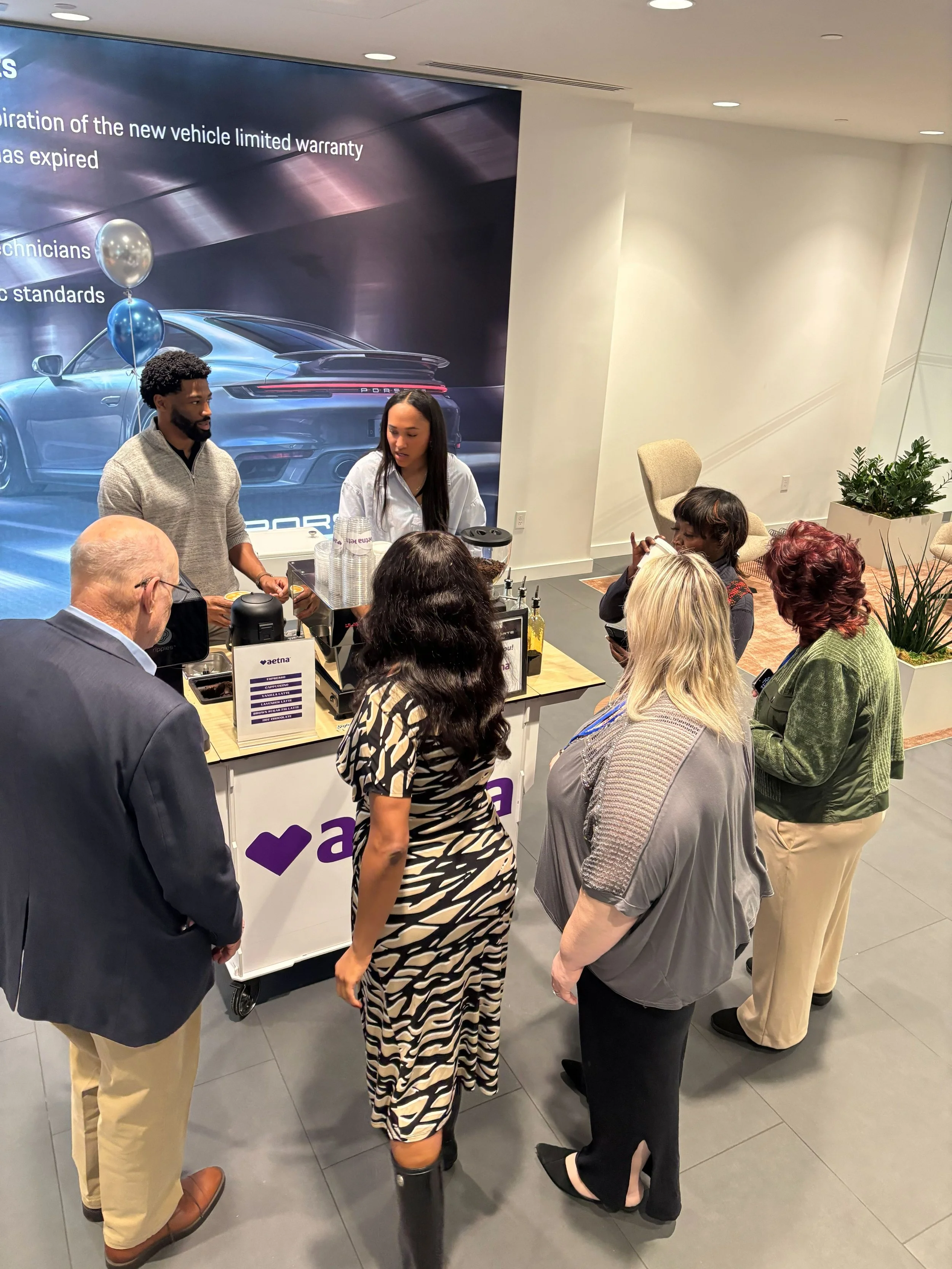 Mobile coffee cart serving handcrafted espresso drinks during corporate networking