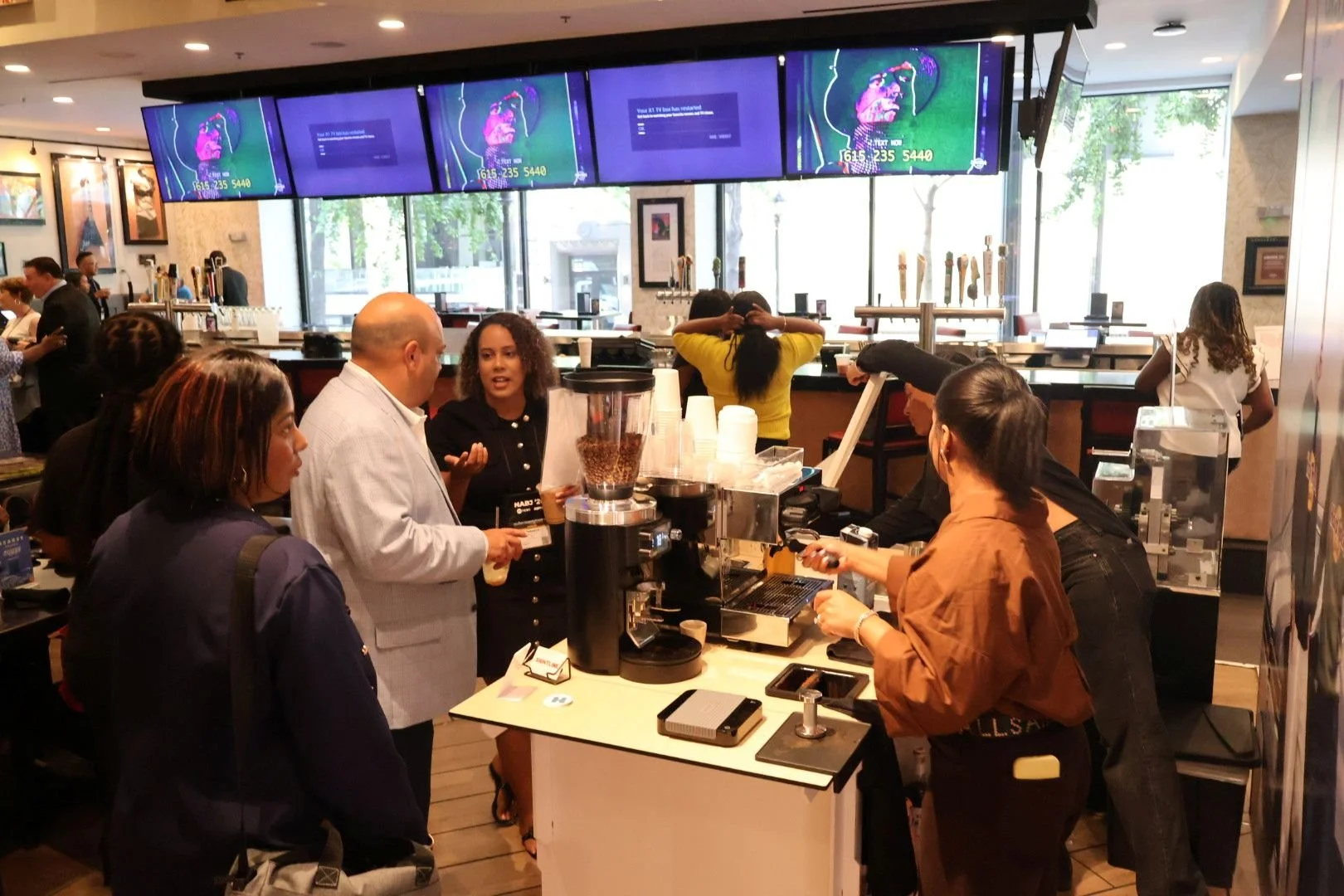 Media professionals in line for coffee at a career fair in Atlanta