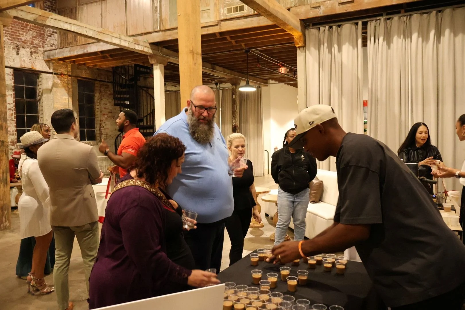 Professional barista serving specialty coffee from a mobile cart