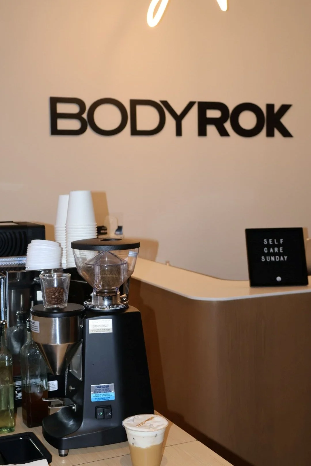 Sightline Coffee barista preparing espresso drinks for BodyRok Inman Park guests