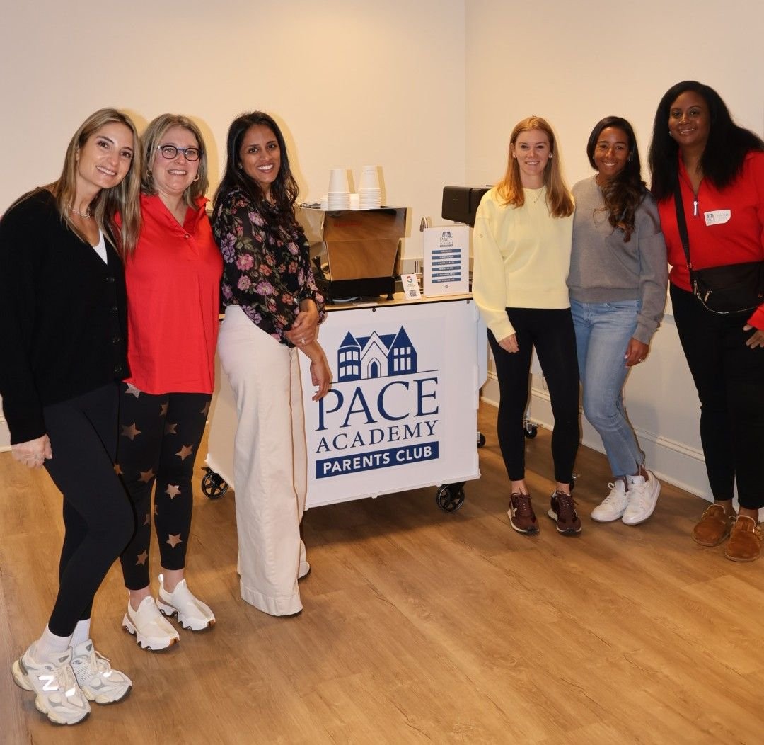 Group of teachers posing together at Atlanta coffee catering setup