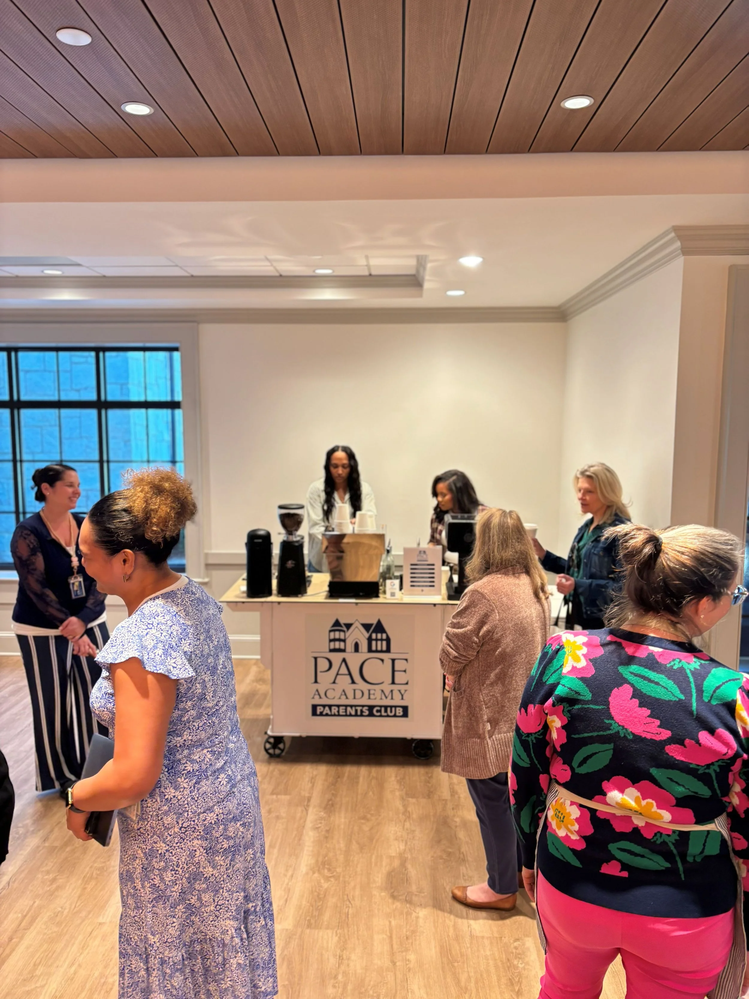 Teachers gathered at Atlanta coffee catering cart during appreciation event