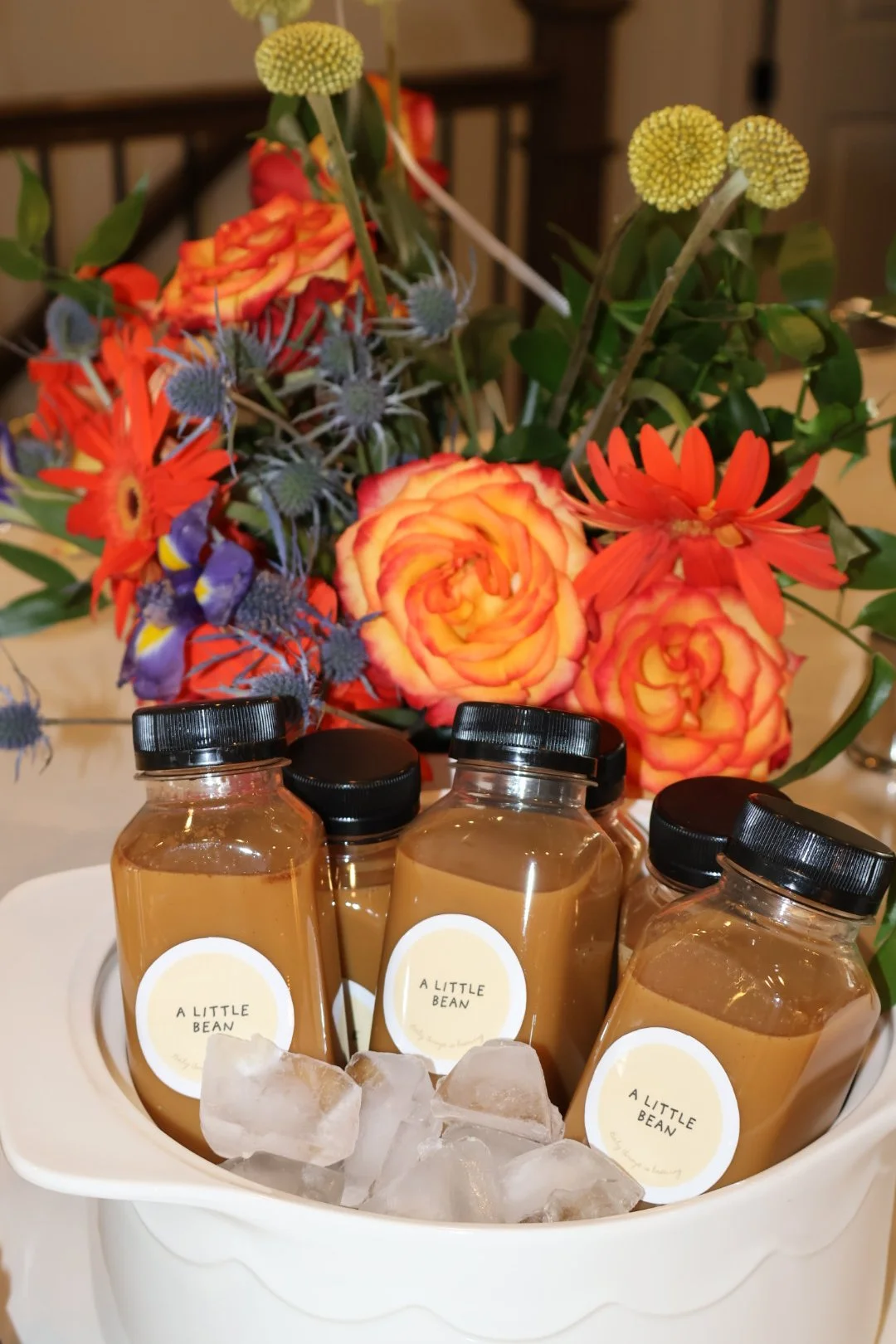 Custom-labeled bottled coffee drinks displayed at an intimate baby shower in Columbus, GA.