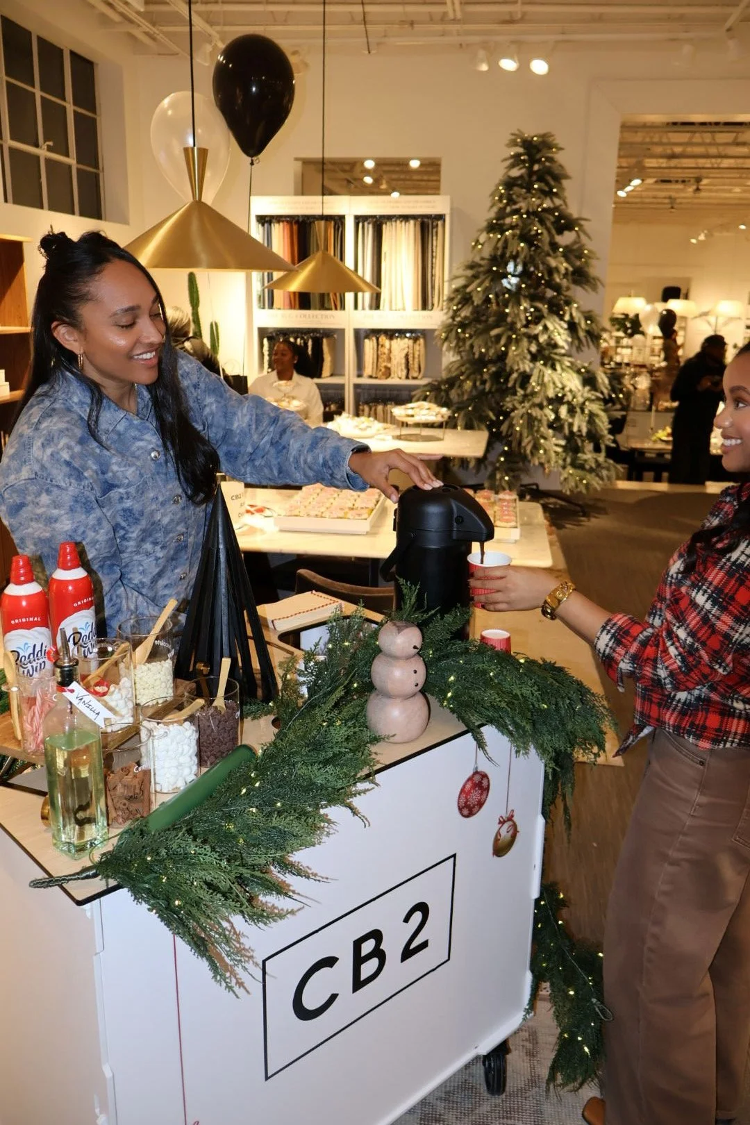 Custom holiday hot chocolate bar set up inside CB2 Atlanta on Howell Mill Road