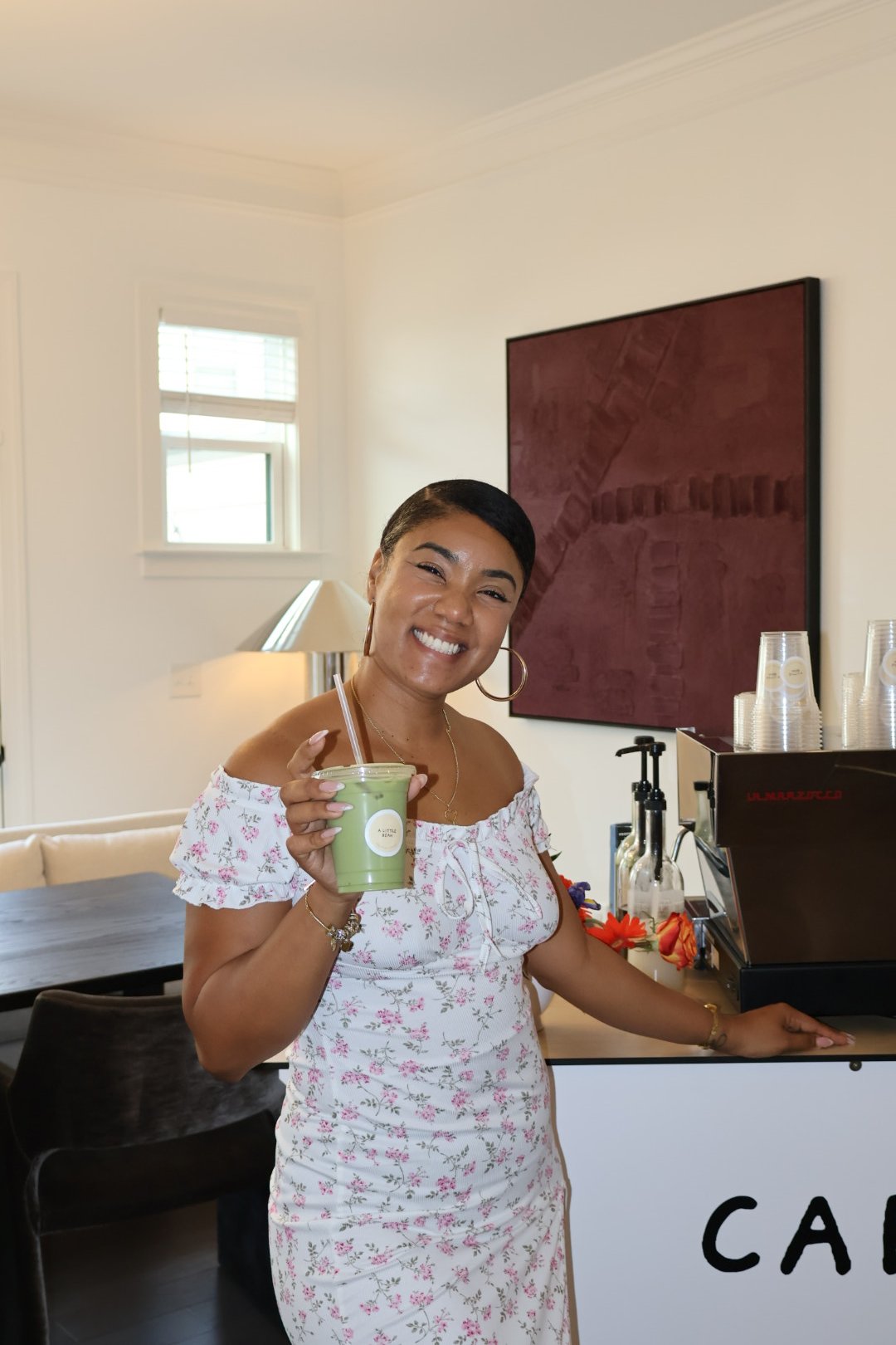 Guest enjoying a specialty matcha drink at a custom coffee bar for a Columbus, GA baby shower.