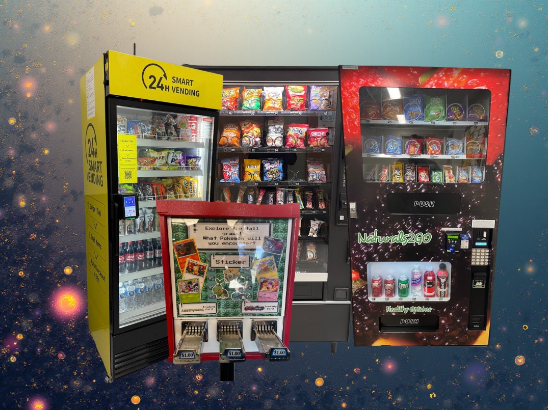 This image shows three vending machines and a sticker machine. The yellow vending machine on the left offers snacks and drinks, with a sign indicating 24-hour service. The middle vending machine contains chips and other snacks. The right vending machine is a beverage vending machine called Natural2GO, offering various drinks, and features a digital payment system. In front of the vending machines is a small sticker machine with a display window showing Pokémon and other stickers, priced at $1.00 each.