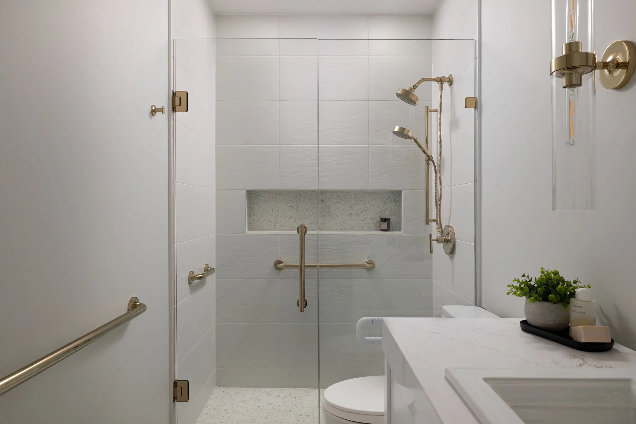 White Bathroom with Gold Fixtures