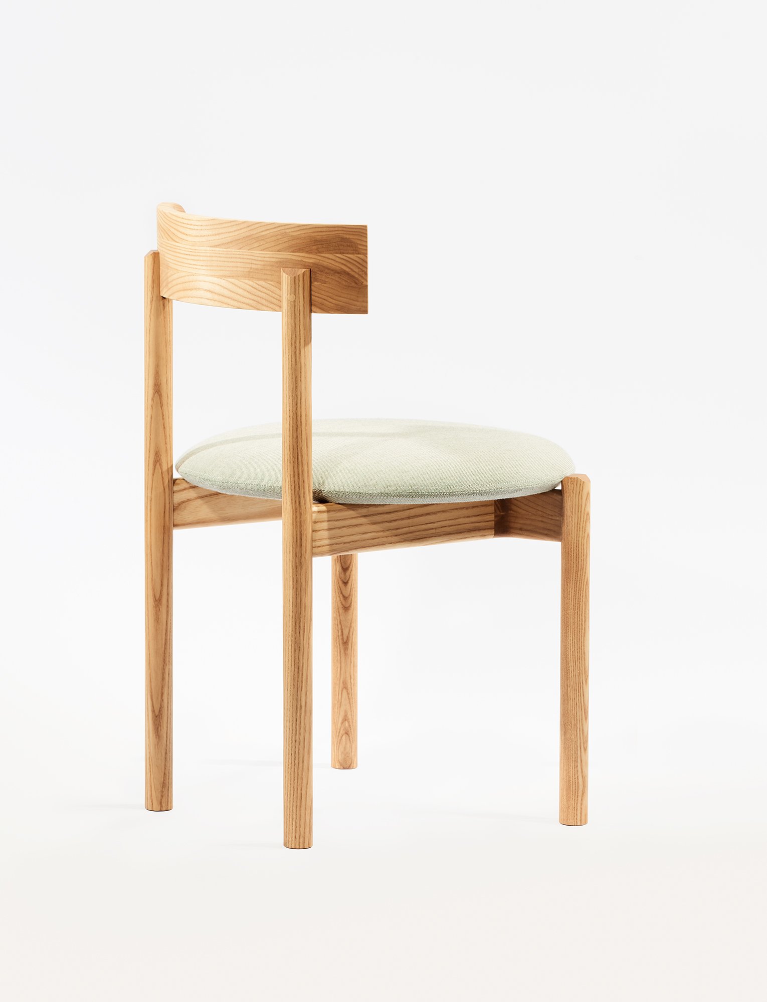 Abbey Side Chair with a clean open back and crisp linear profile, presented as a lightweight seating option in the Ourse range.