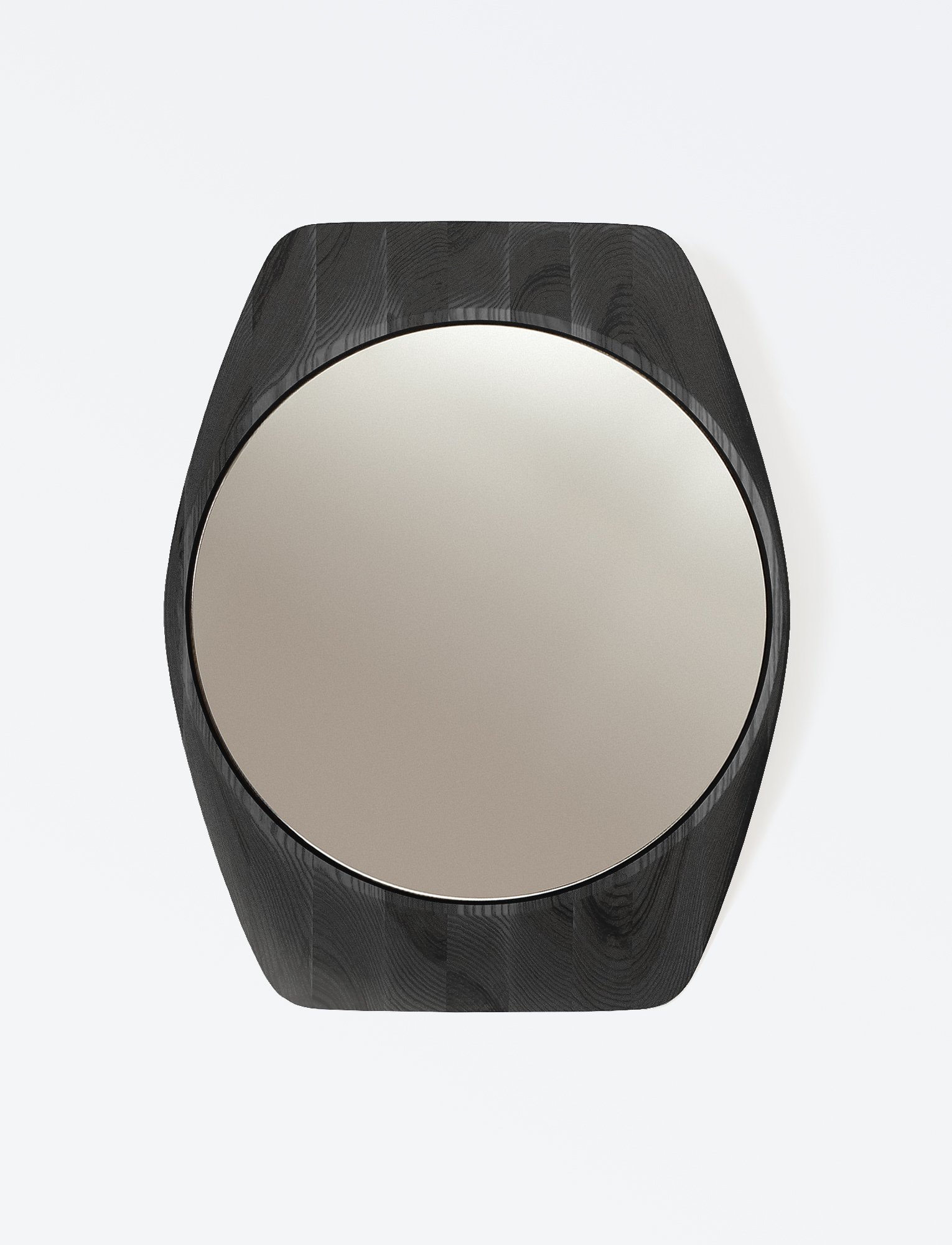 Tortue Mirror featuring a compact horology inspired outline and organic edge transitions, highlighting its sculpted geometric character within the Ourse collection.