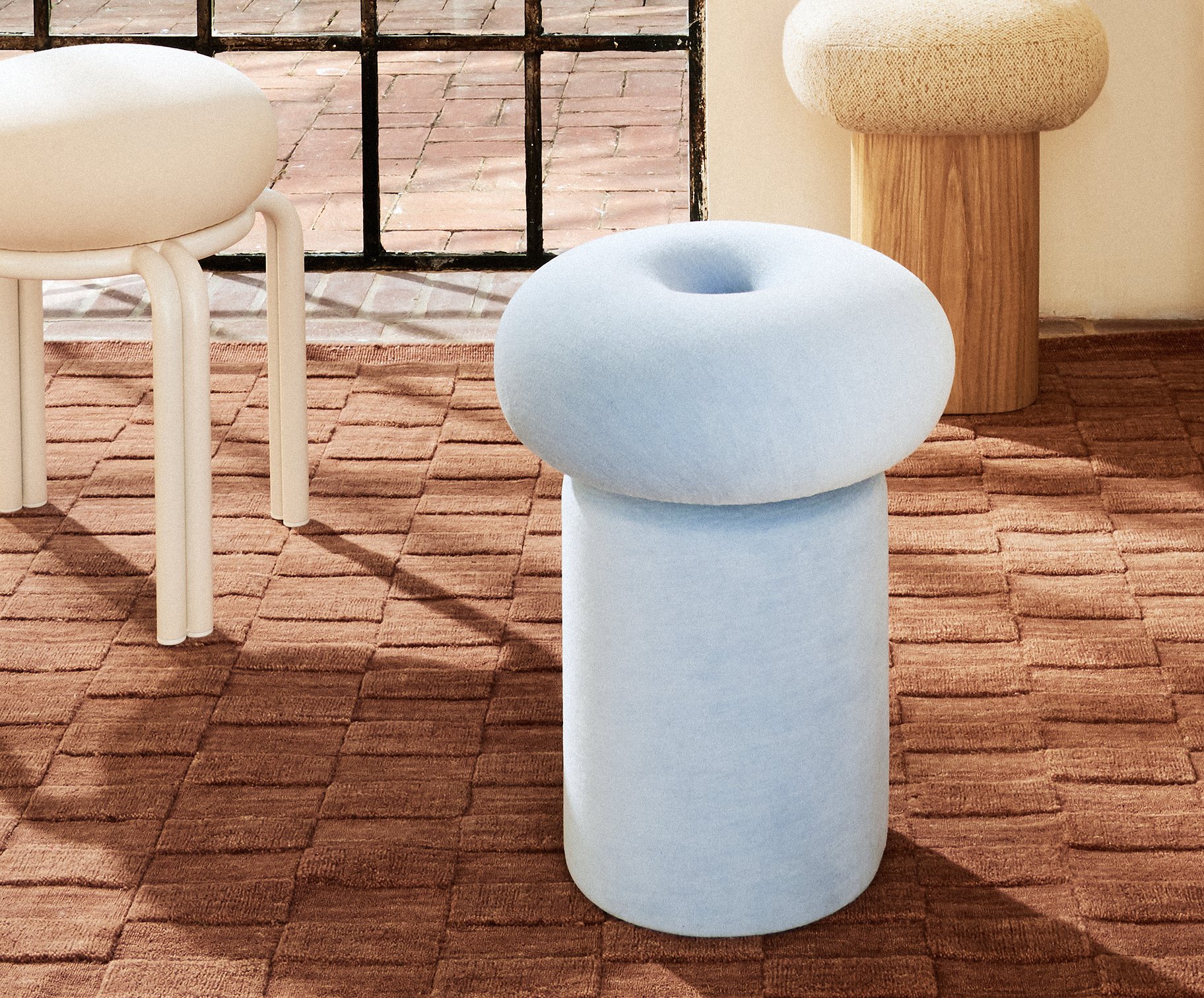 Soufflé Stool handcrafted in Canada with soft sculptural upholstered forms and contemporary bauhaus metal detailing by Ourse.