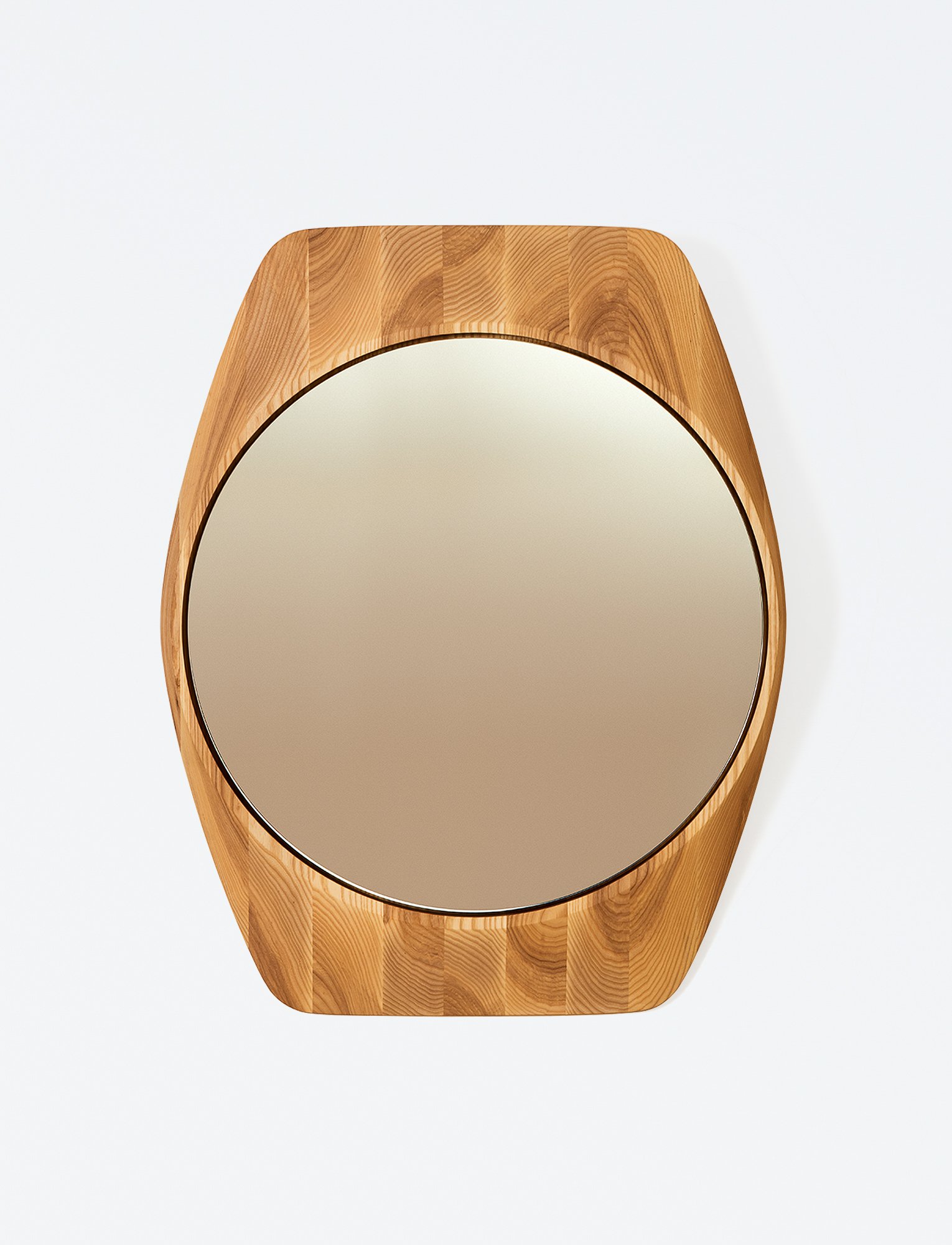 Tortue Mirror featuring a compact horology inspired outline and organic edge transitions, highlighting its sculpted geometric character within the Ourse collection.