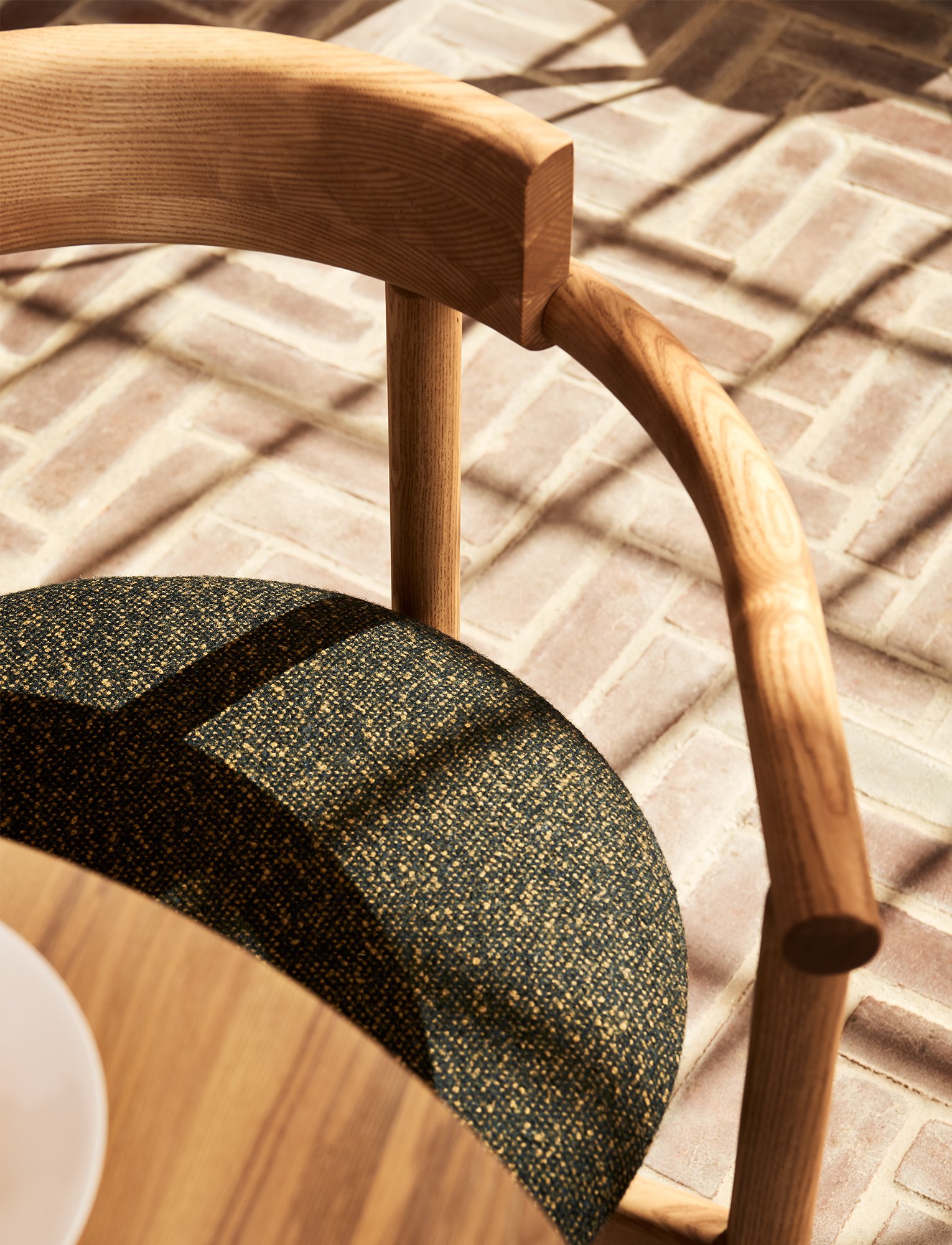 Abbey Dining Chair designed and made in Canada, featuring a contemporary solid wood frame and minimalist silhouette by Ourse.