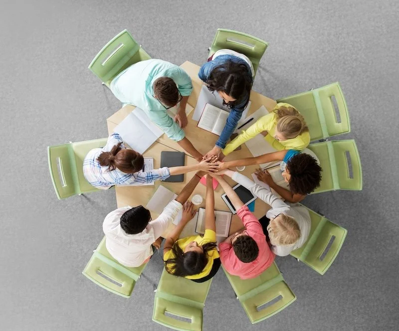 group of people sat round a table