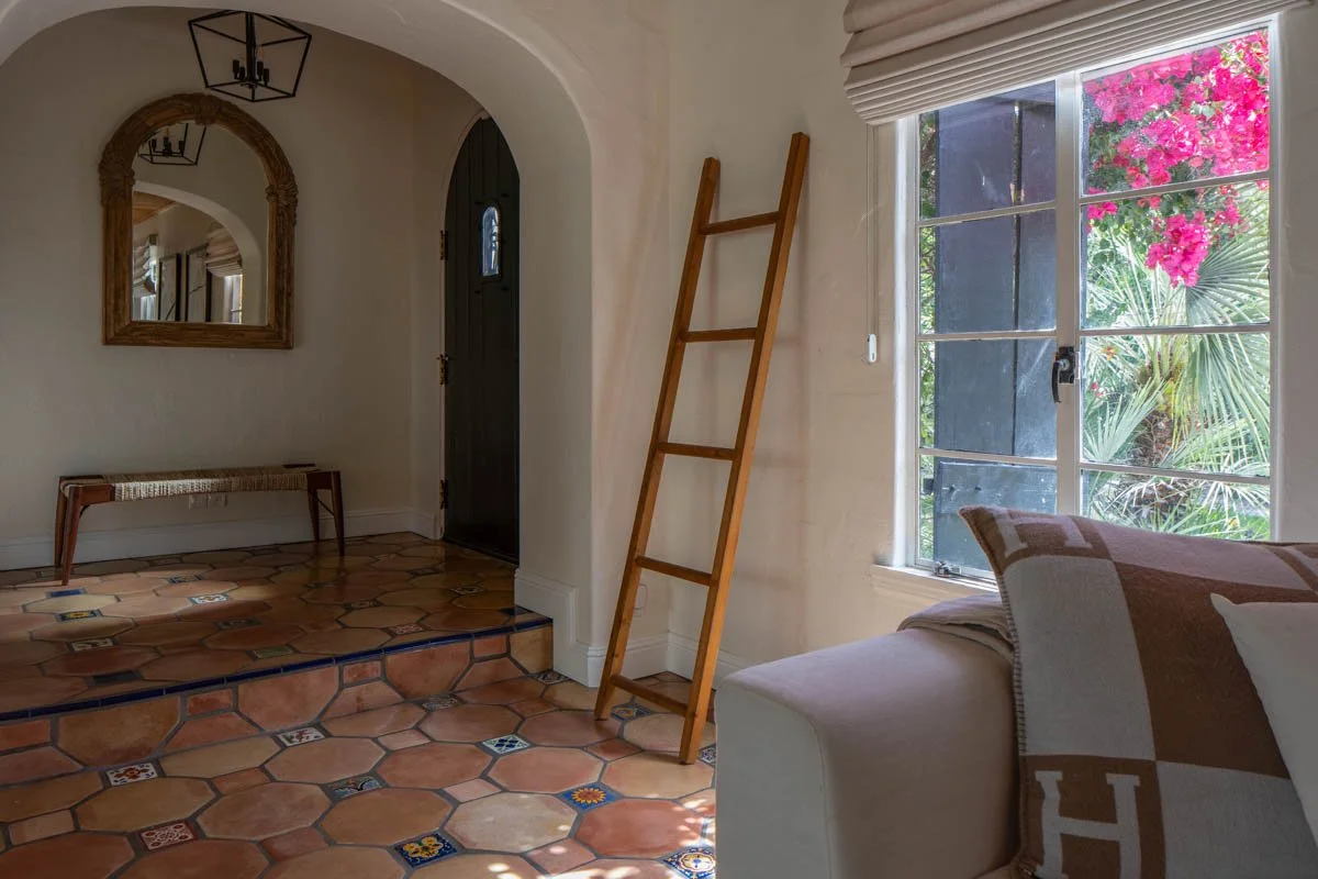 Palm Springs, CA | Living Room & Entry Remodel | Terracotta Tile Floor, white sofa, and bench near front door