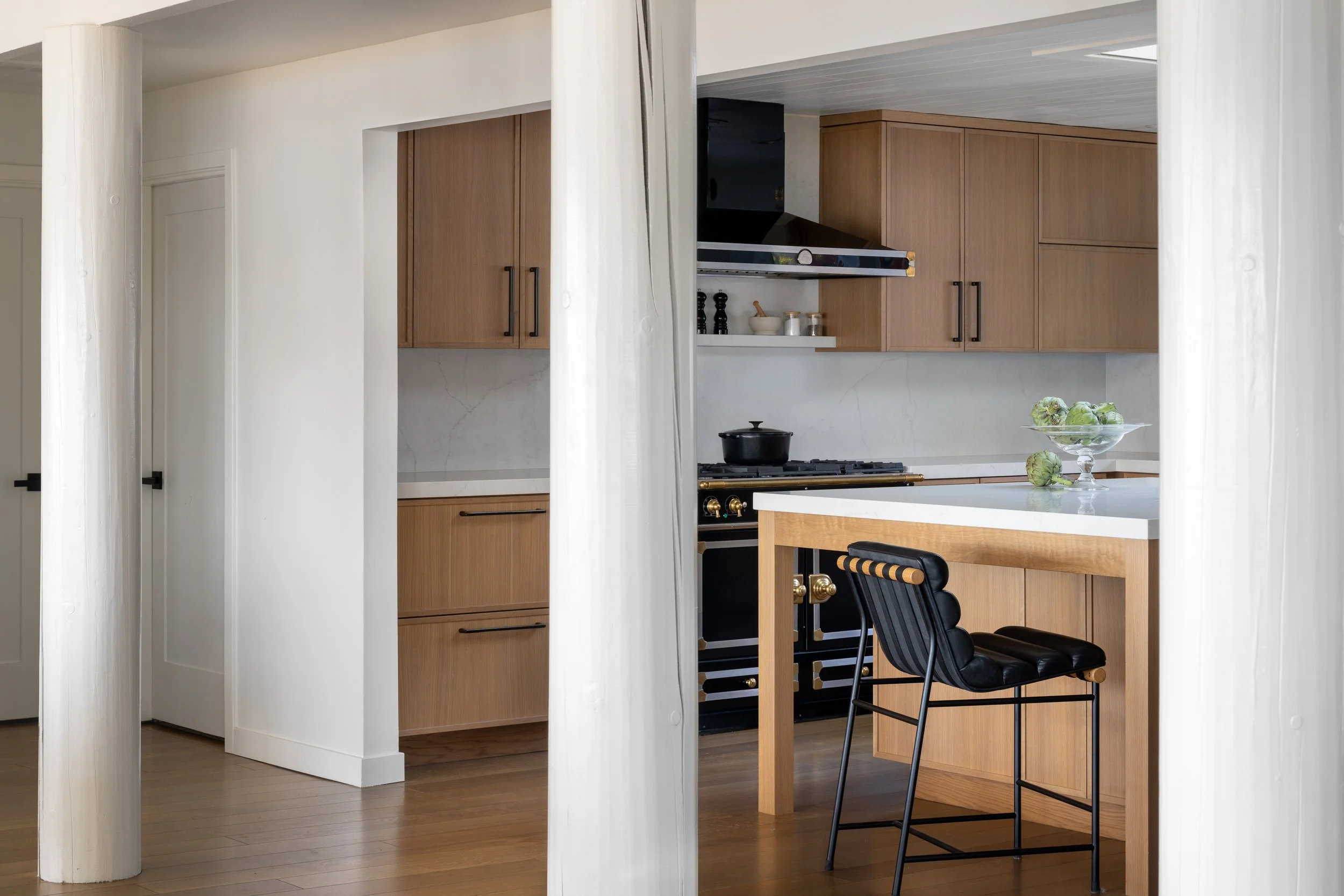 Gig Harbor Kitchen Remodel | White Structural posts line kitchen entrance