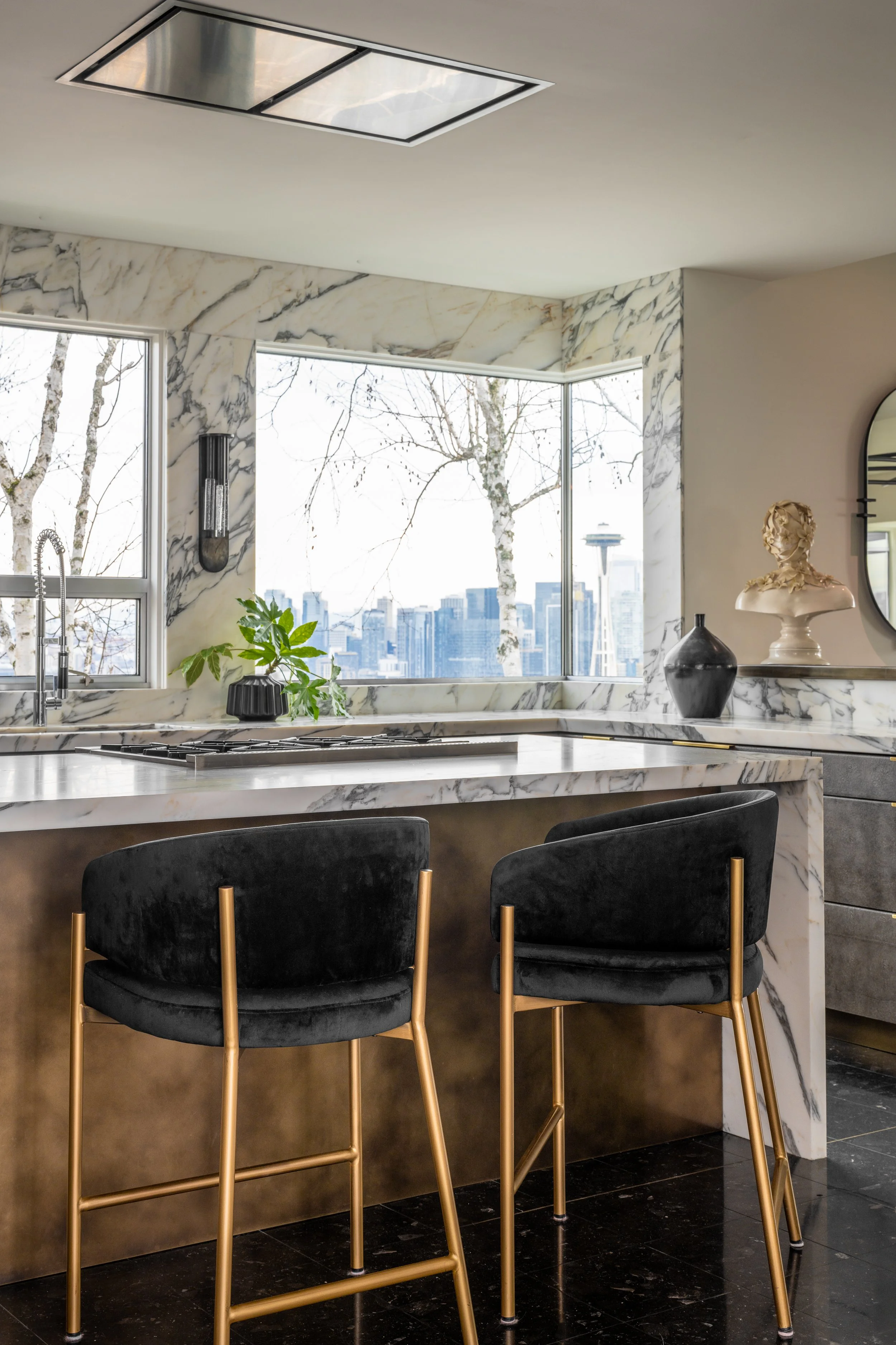 Remodeled kitchen in the Queen Anne neighborhood of Seattle. Marble waterfall counter and walls. 